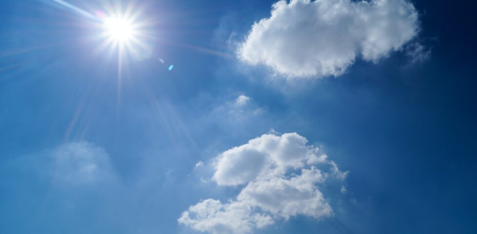 Bright sunlight in an almost-cloudless blue sky.