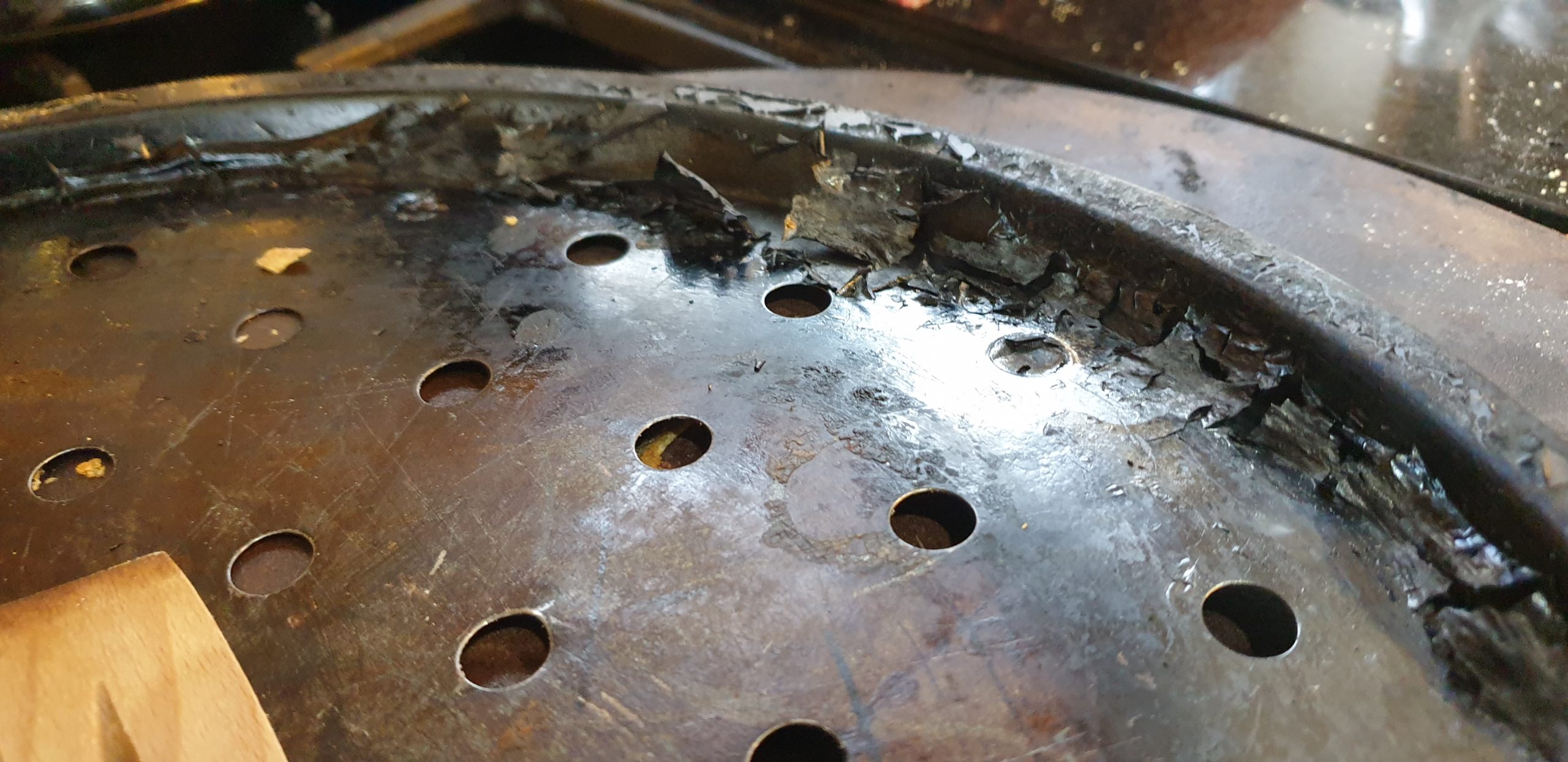 Full image of Charred non-stick coating on a tray.