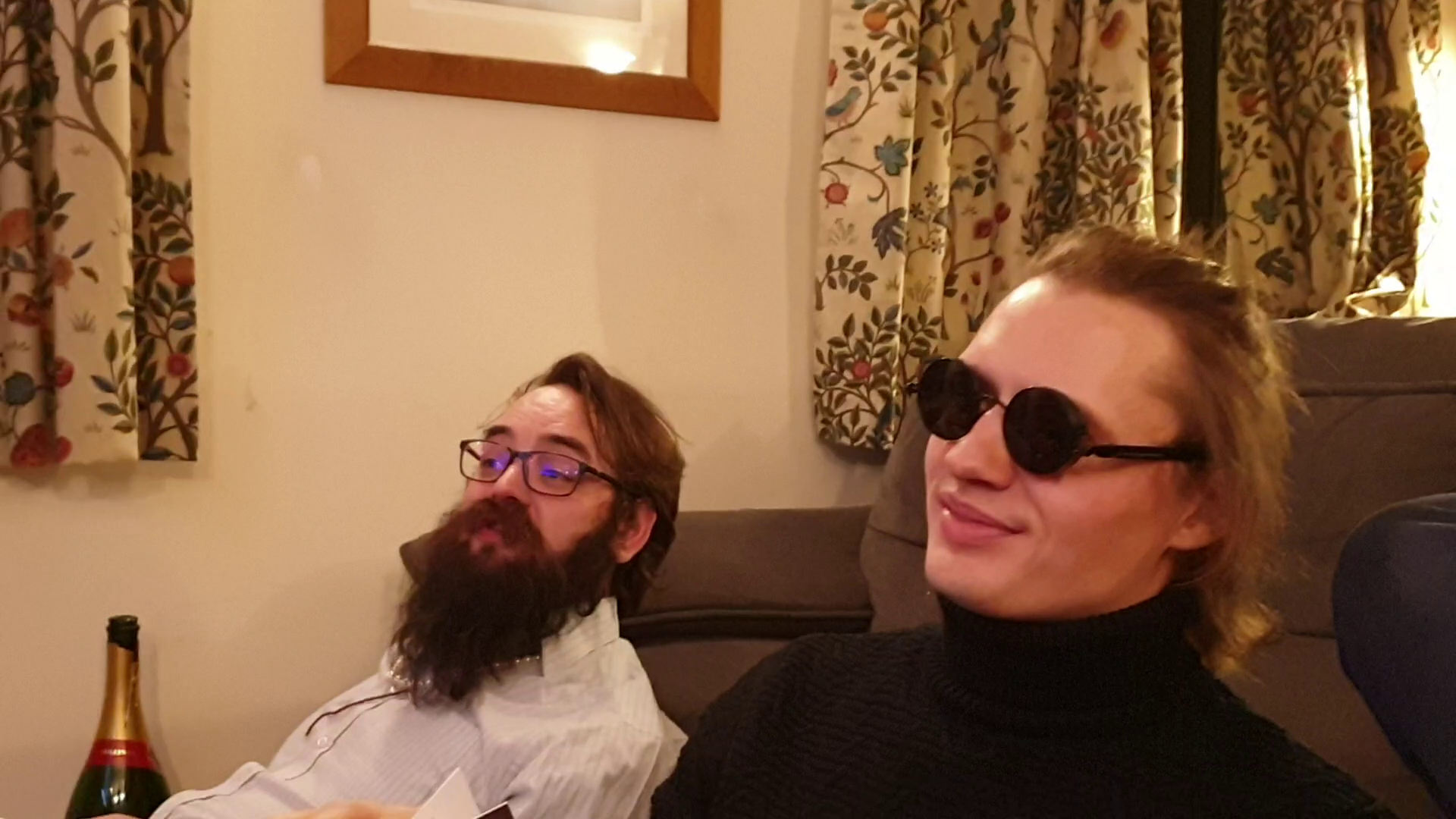 Full image of JTA (wearing a string of pearls) and Robin (wearing sunglasses)