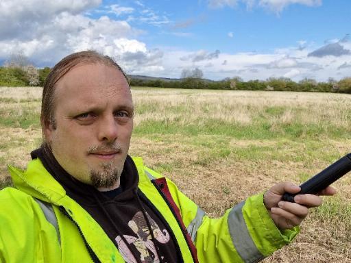 Geocacher with a selfie-stick