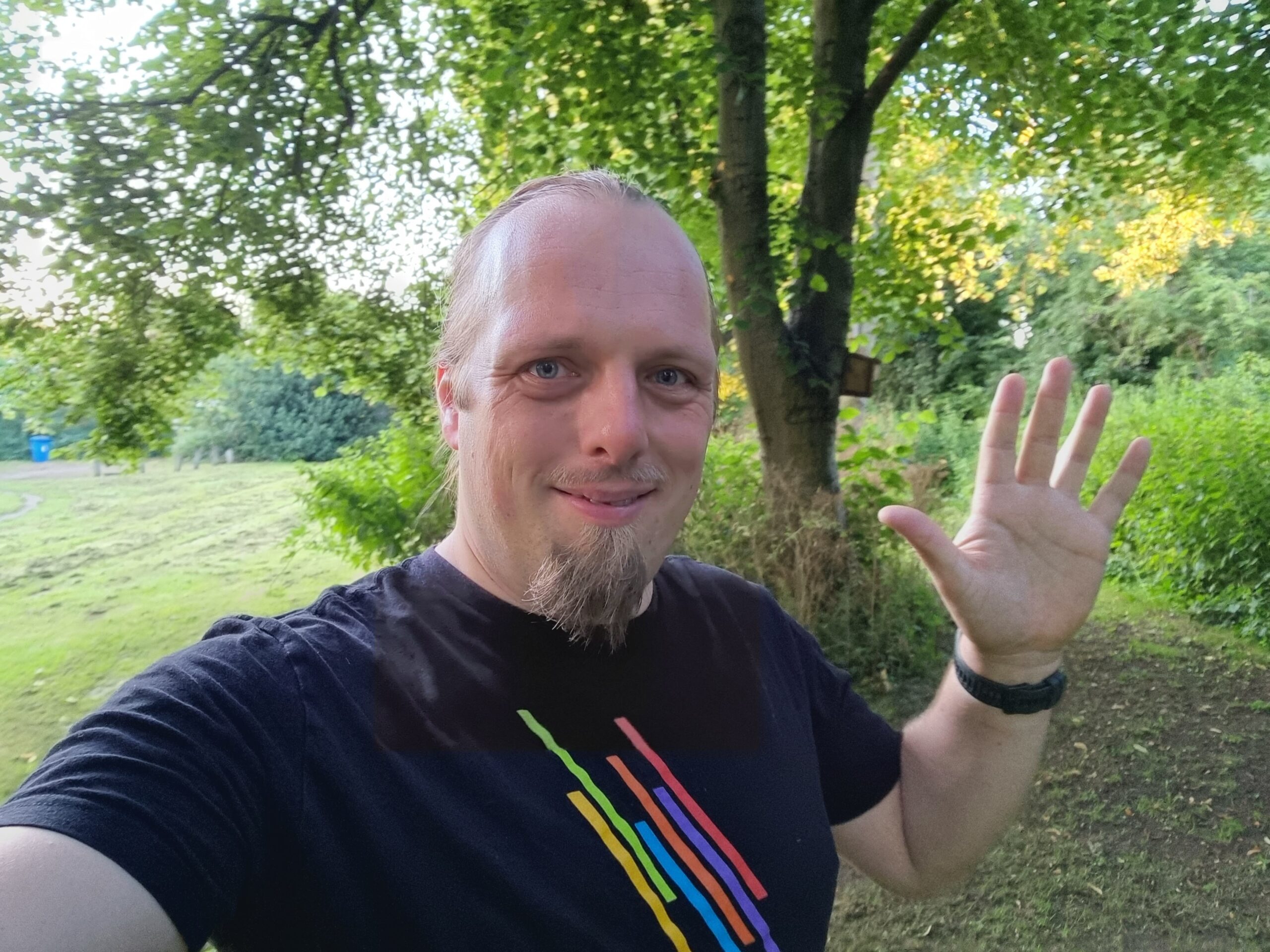 Full image of Dan hunting for a geocache in Lichfield.