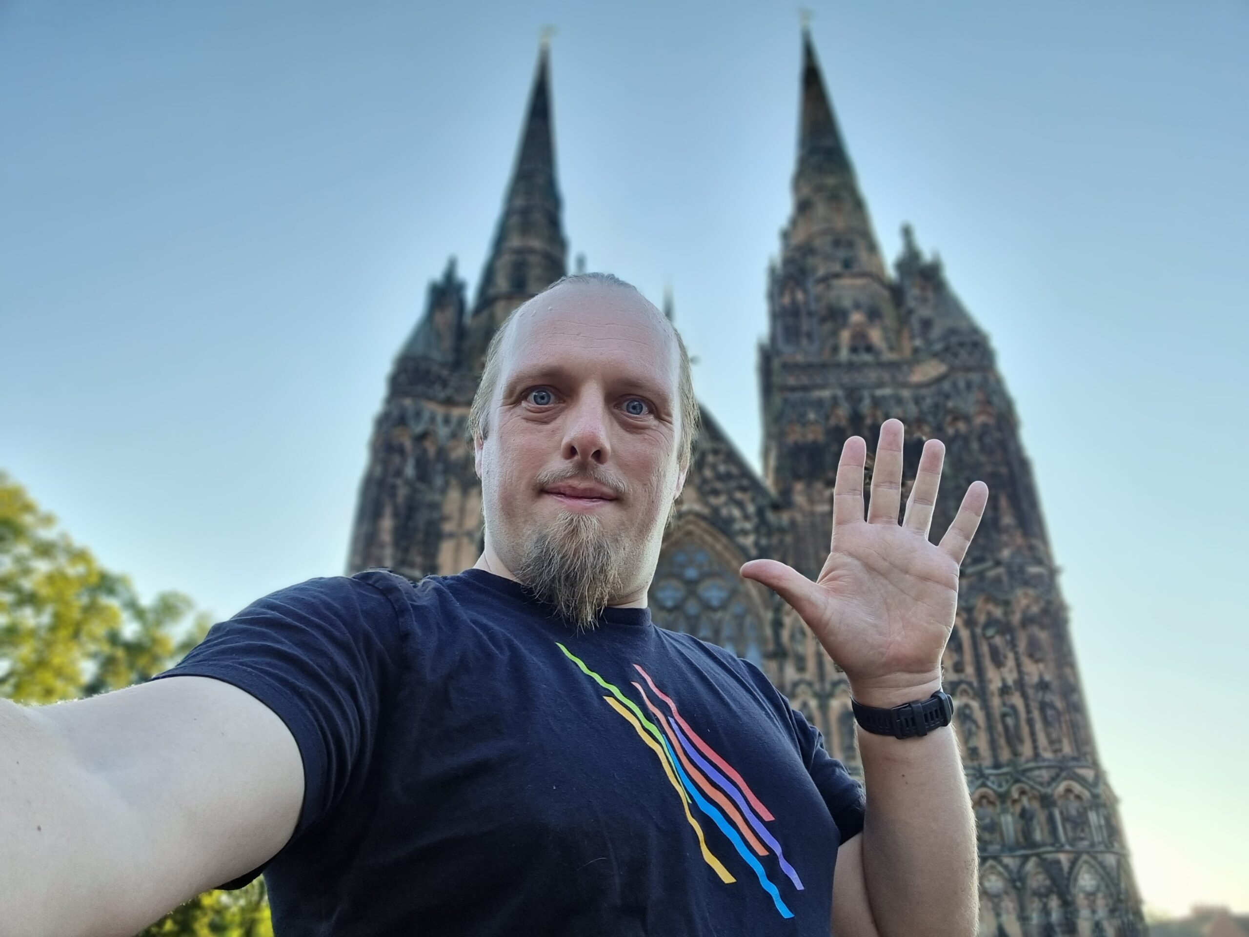Full image of Dan in froint of Lichfield Cathedral, waving