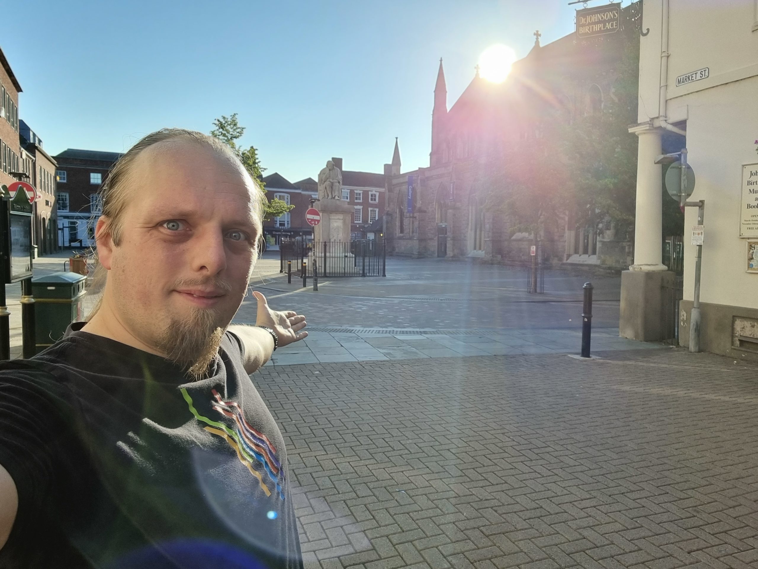 Full image of Dan in Lichfield city centre, deserted early on a Sunday morning.