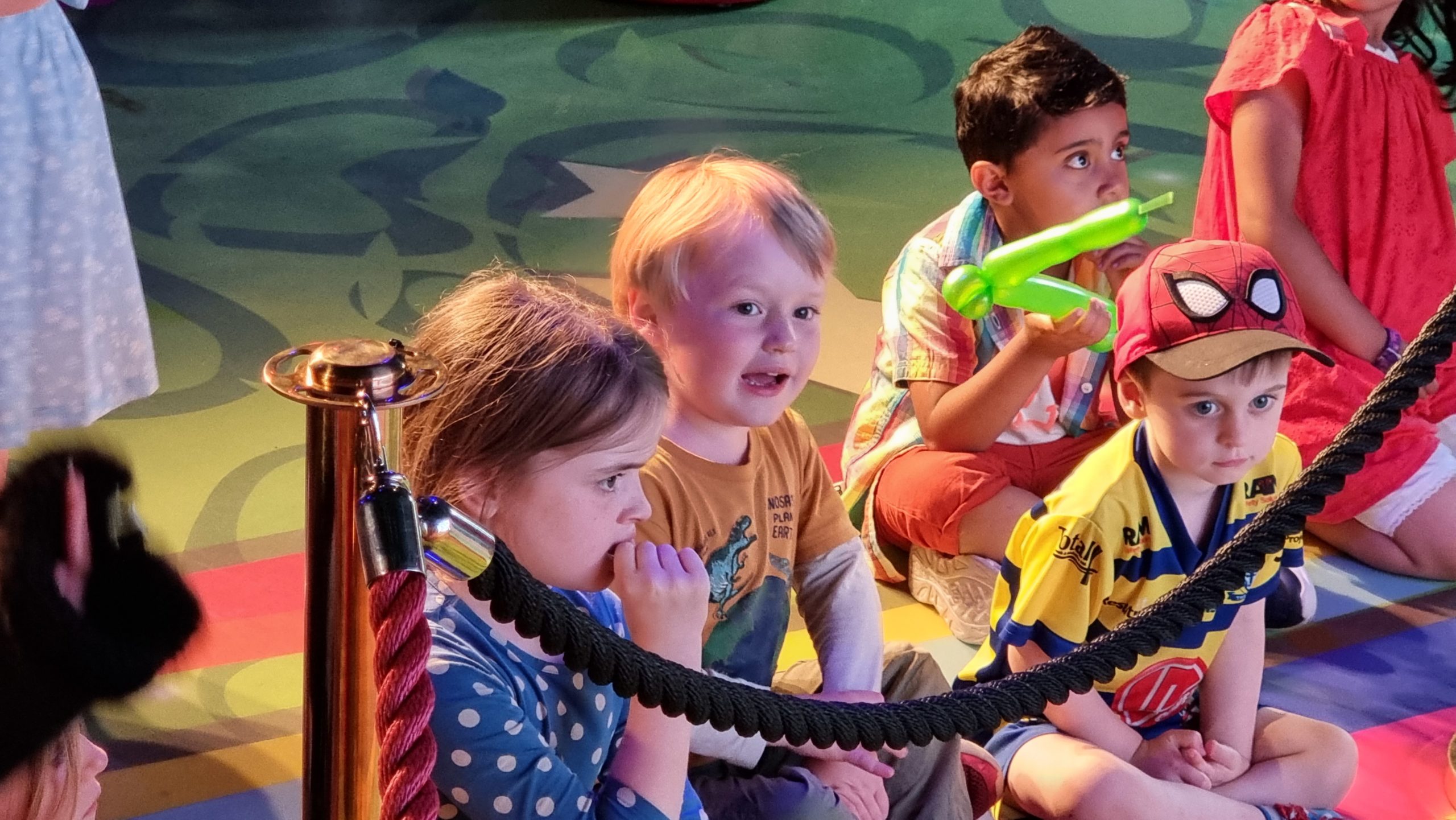 Full image of Children watching a show in the hotel.