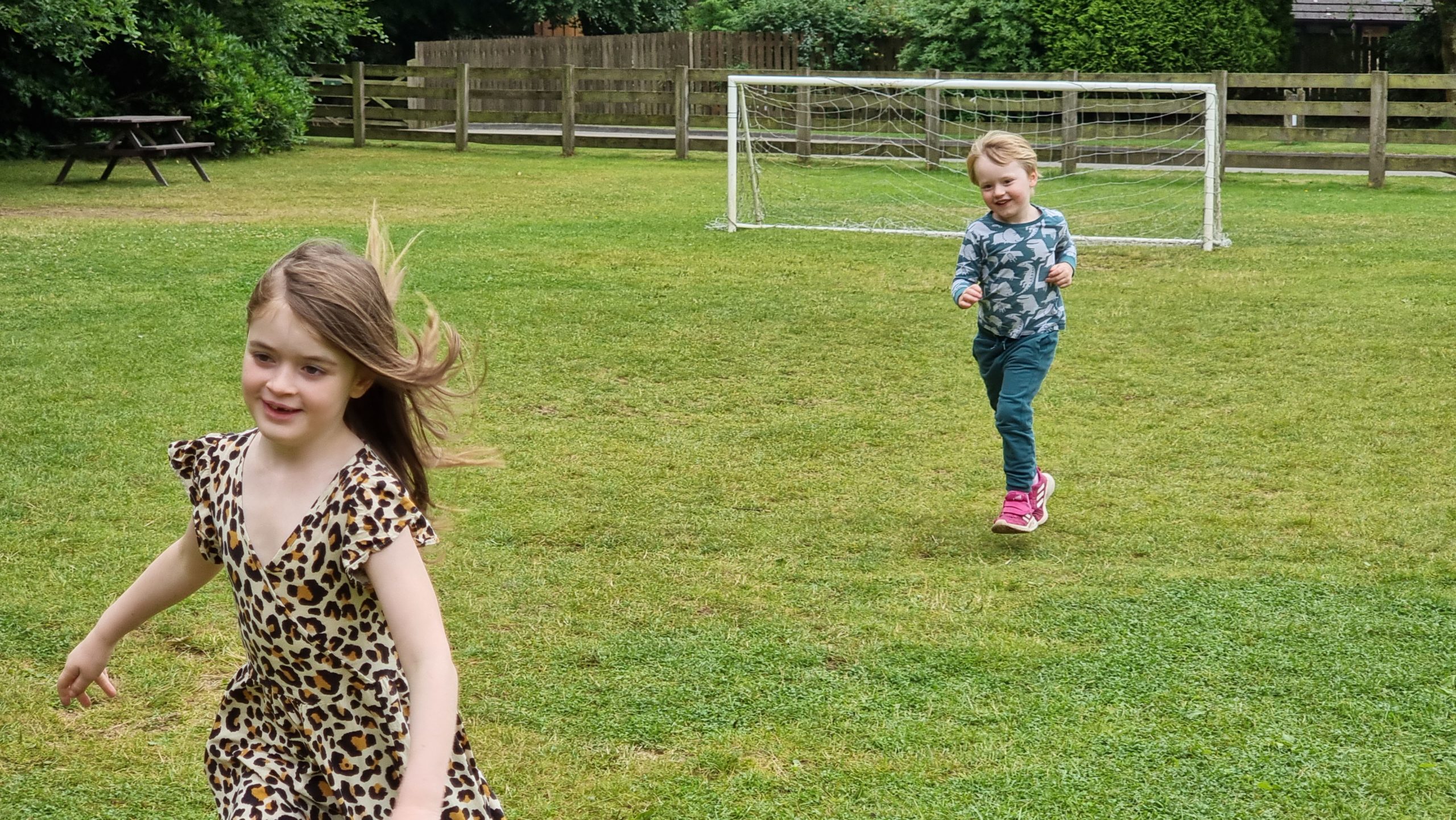 Full image of Running around on a football pitch.