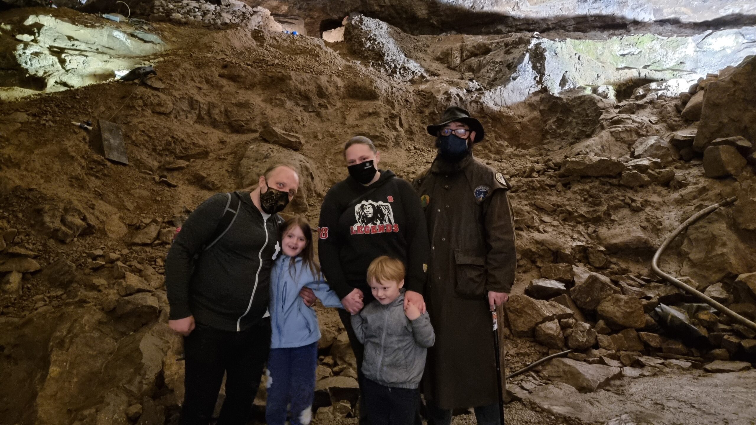 Full image of Family down a cave.