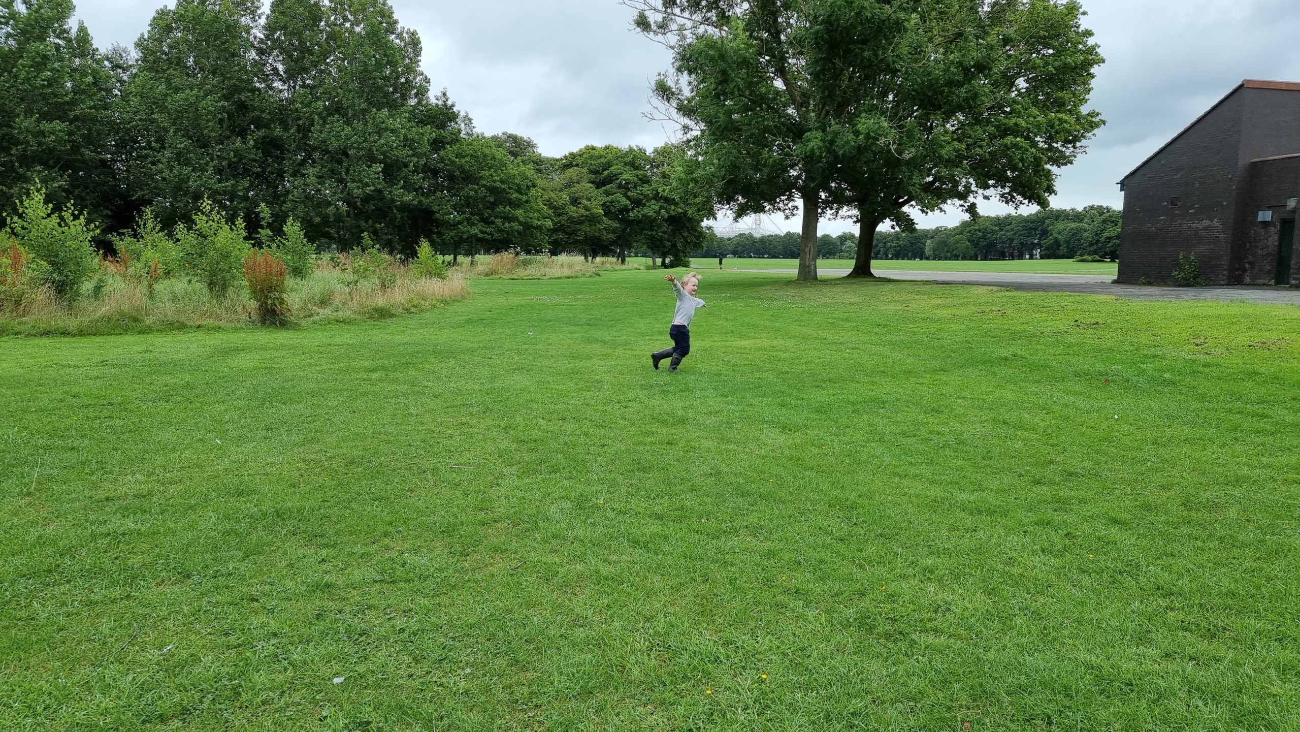 Full image of A boy runs in the distance.