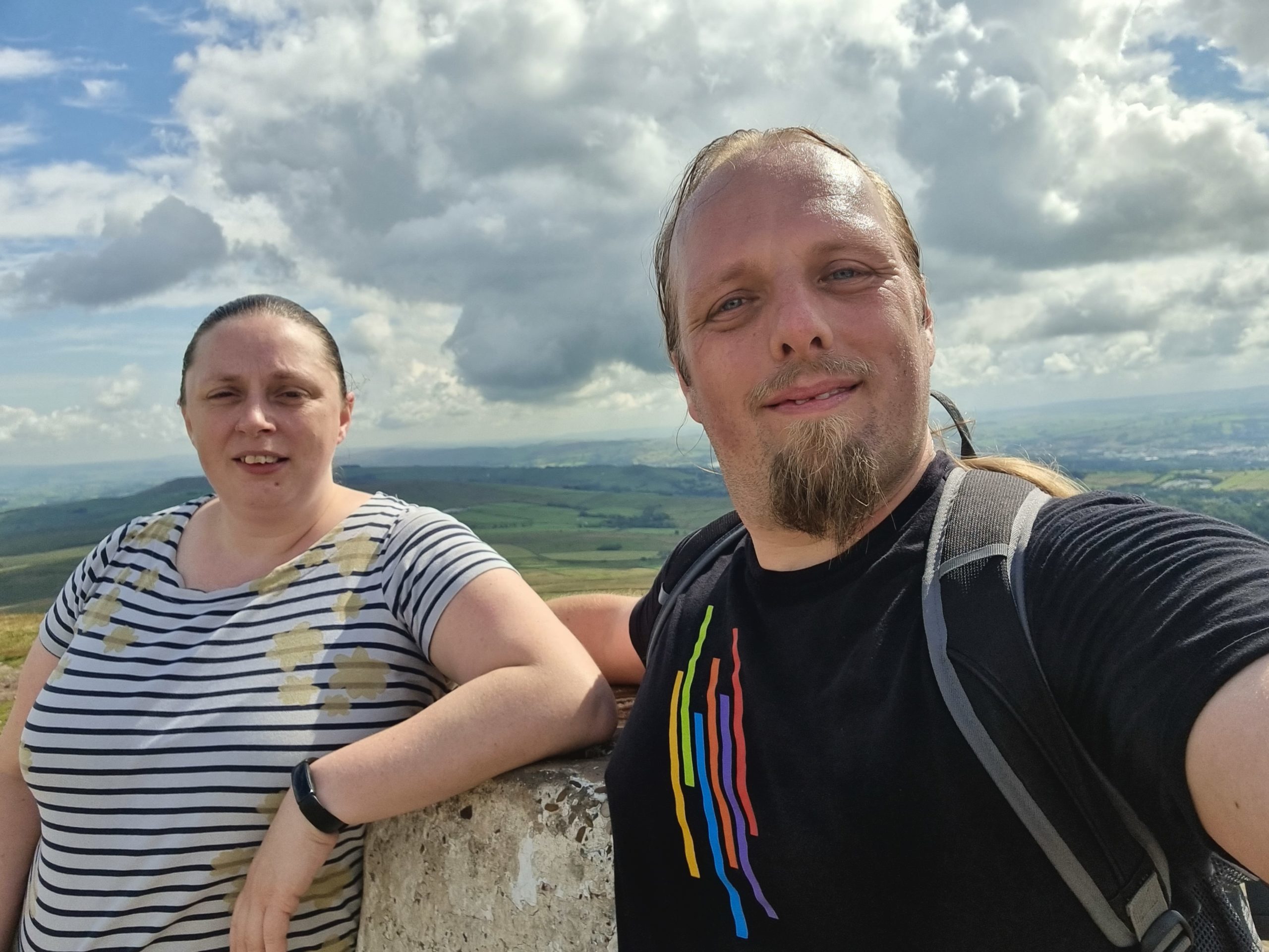 Full image of Ruth and Dan at the trig point at the summit of Pendle Hill.
