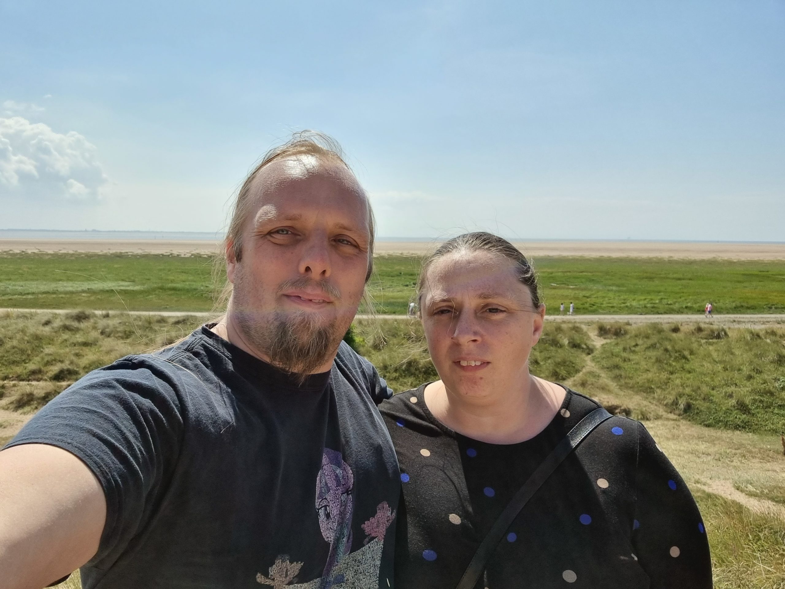 Full image of Dan and Ruth with the sea in the background.