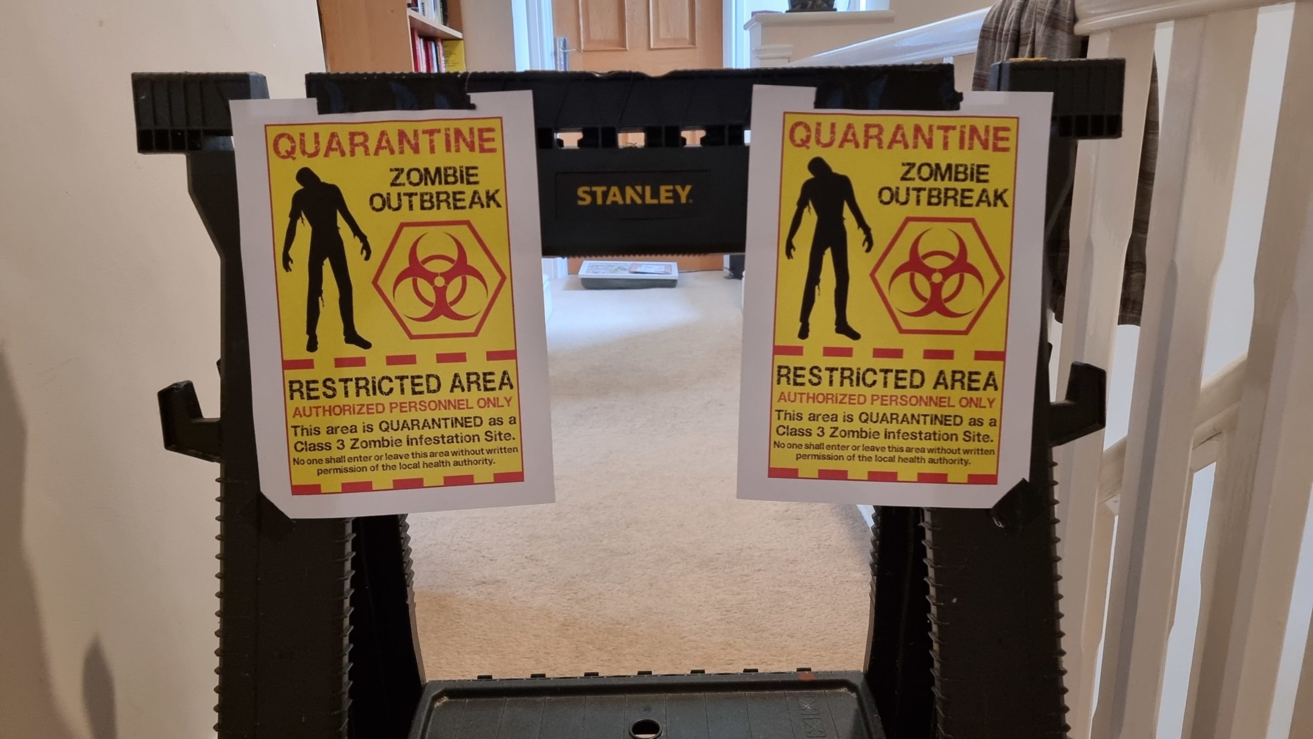 Full image of Barricade with signs reading "Quarantine: Zombie Outbreak"