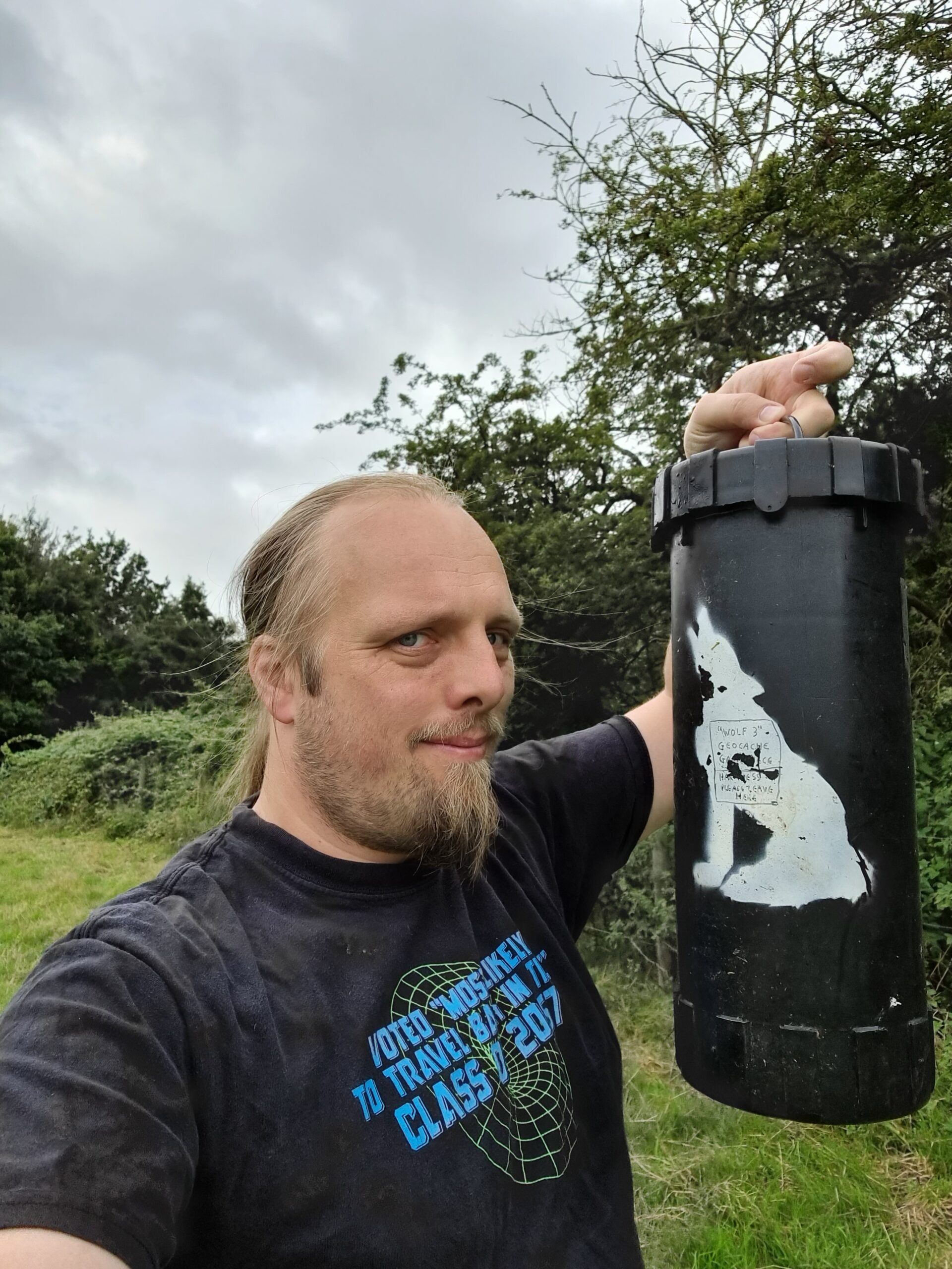 Full image of Dan with Oxford's the Wild Wolf 3 final stage cache container.