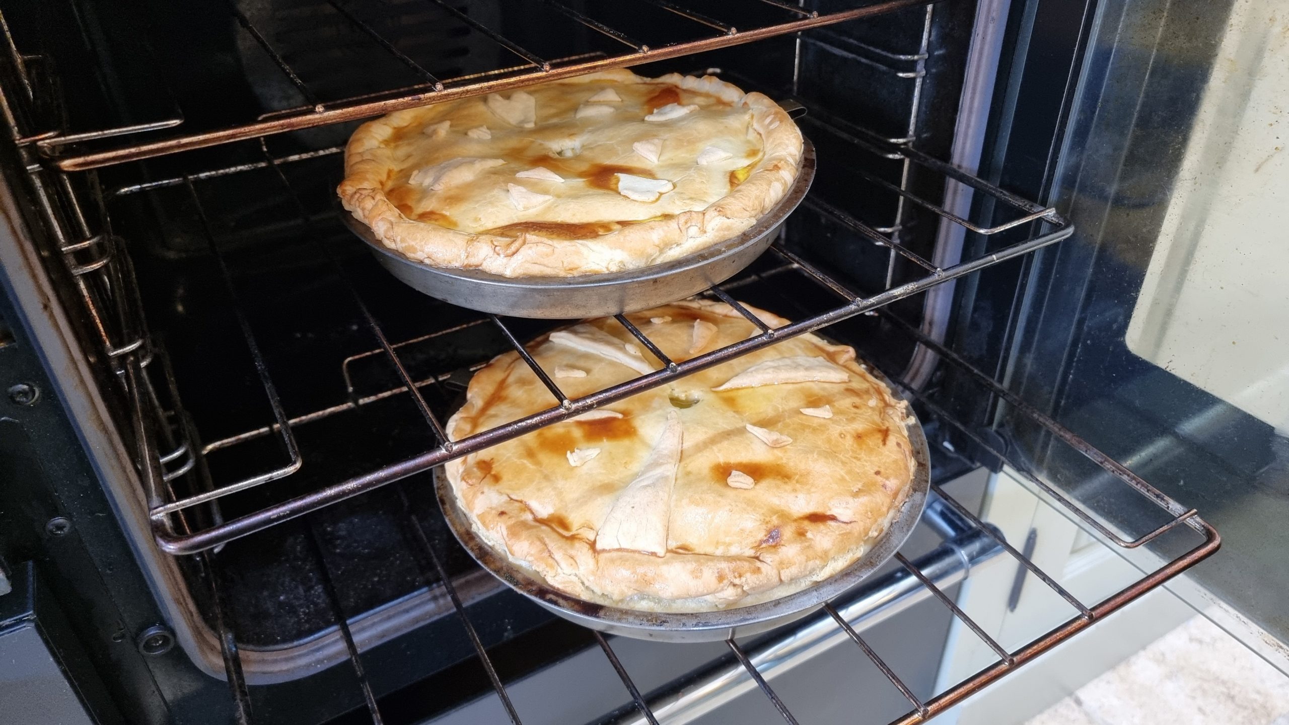 Full image of Butter pies in an oven.
