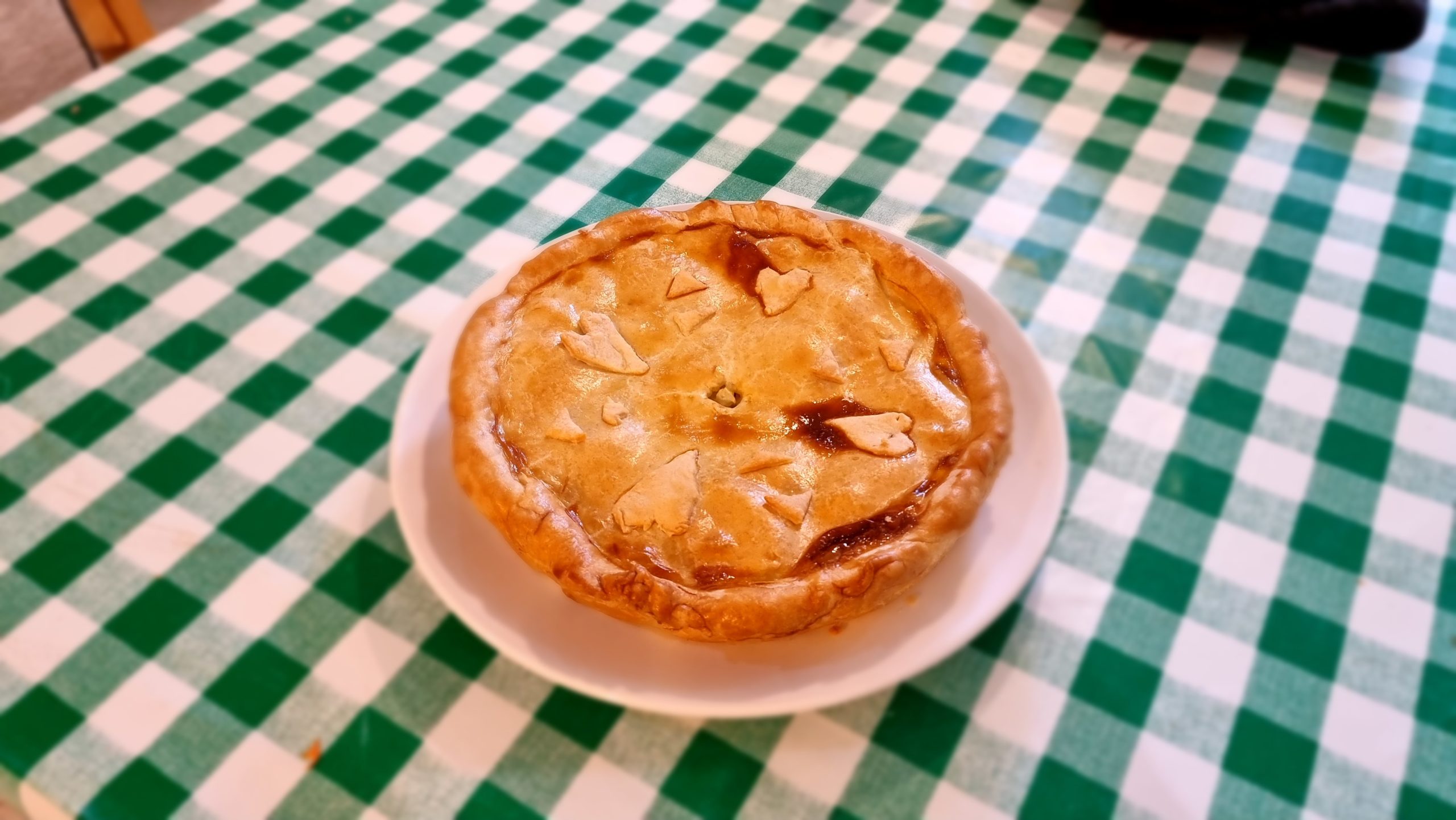 Full image of A butter pie with heart-shaped pastry decorations.