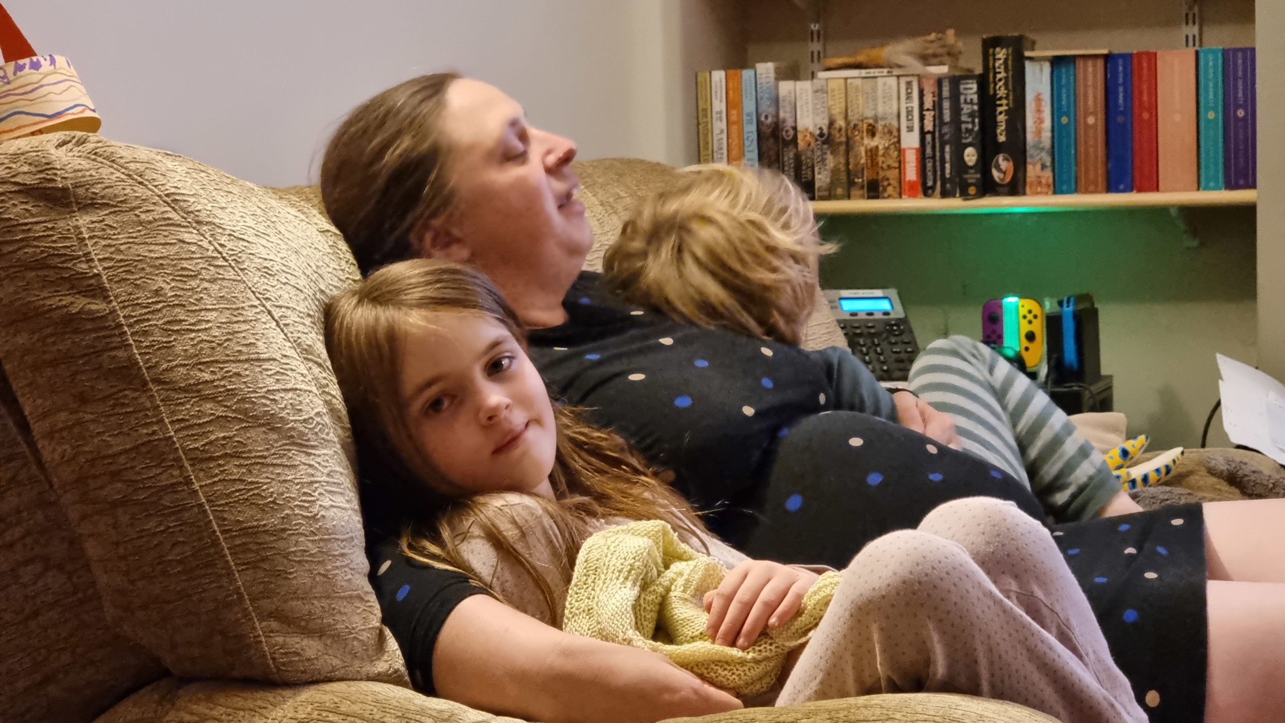 Full image of Ruth and the kids in a heap at the end of the virtual concert.