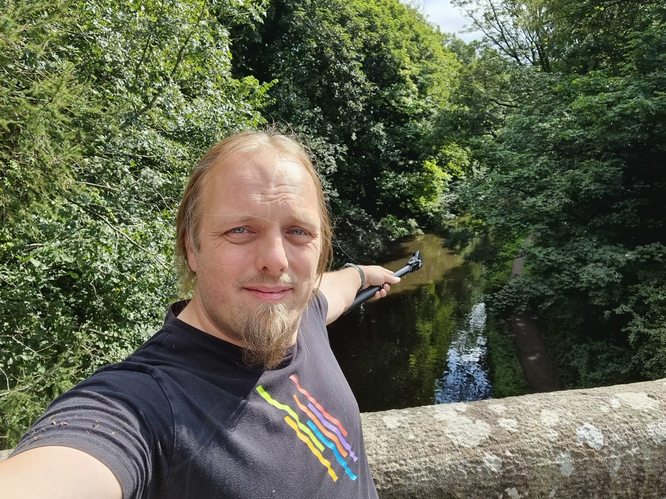 Full image of Dan pointing down a canal.