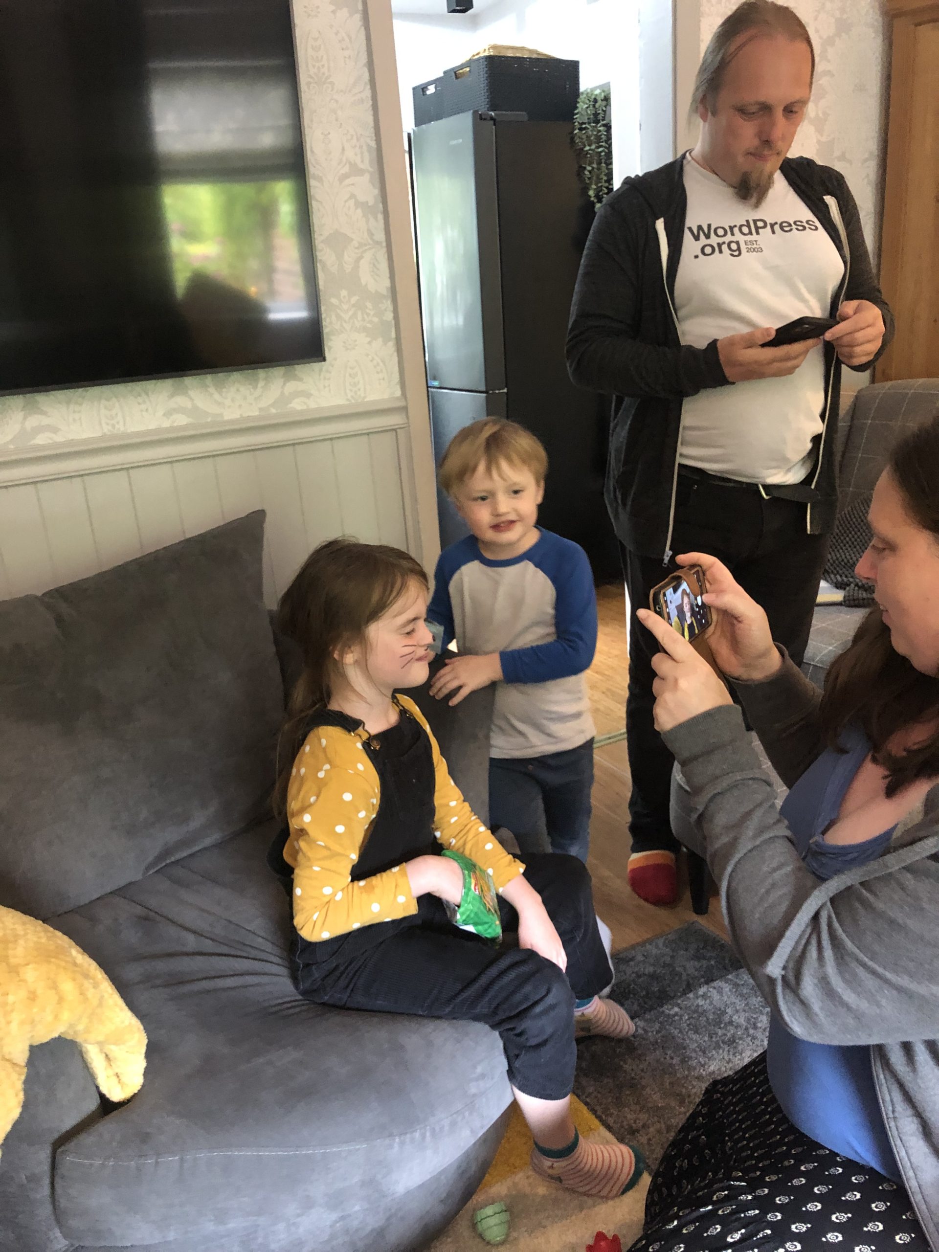 Full image of Dan takes a picture of Ruth taking a picture of the kids.