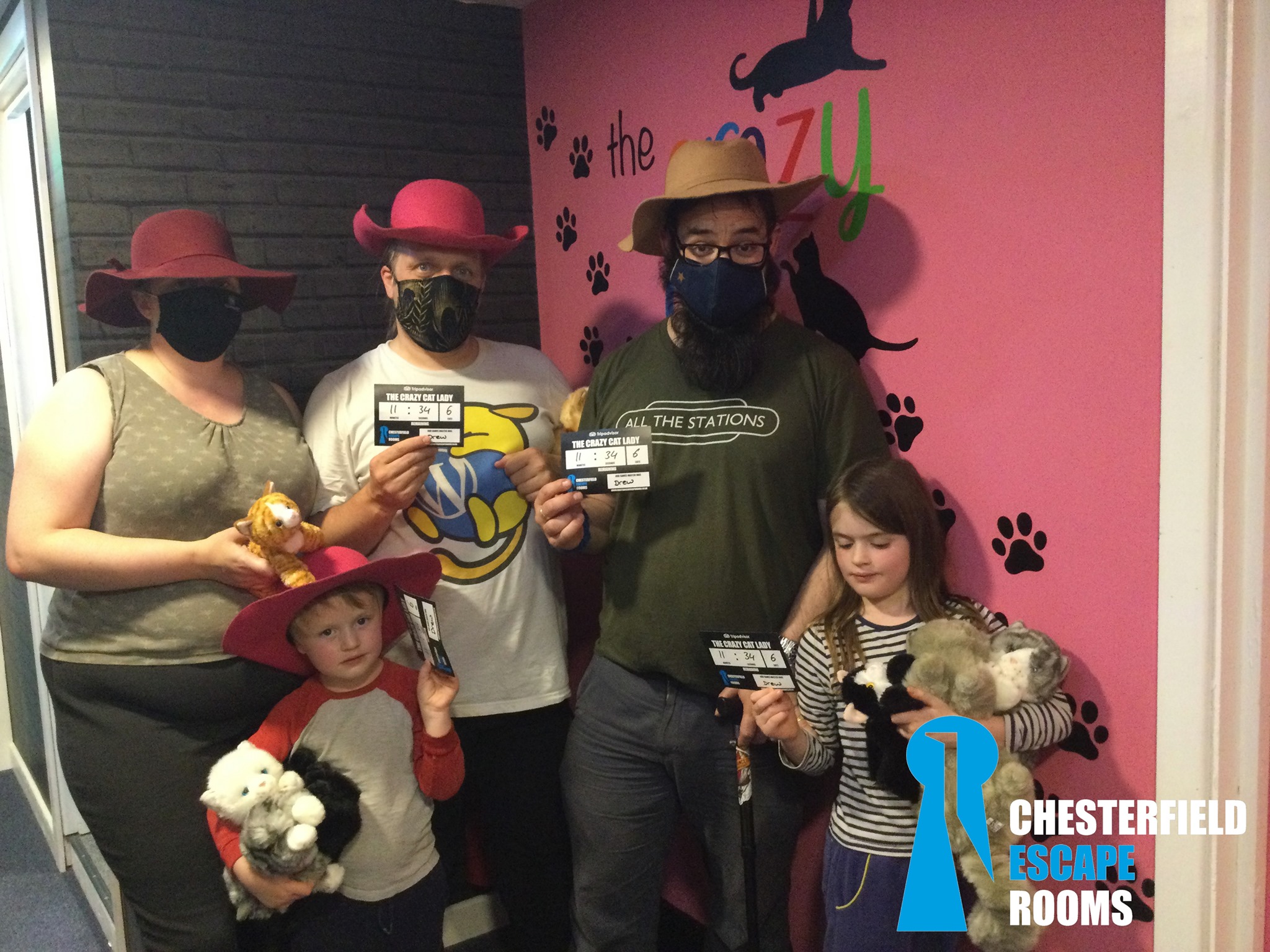 Full image of Dan, Ruth, JTA and the kids at the Crazy Cat Lady escape room.