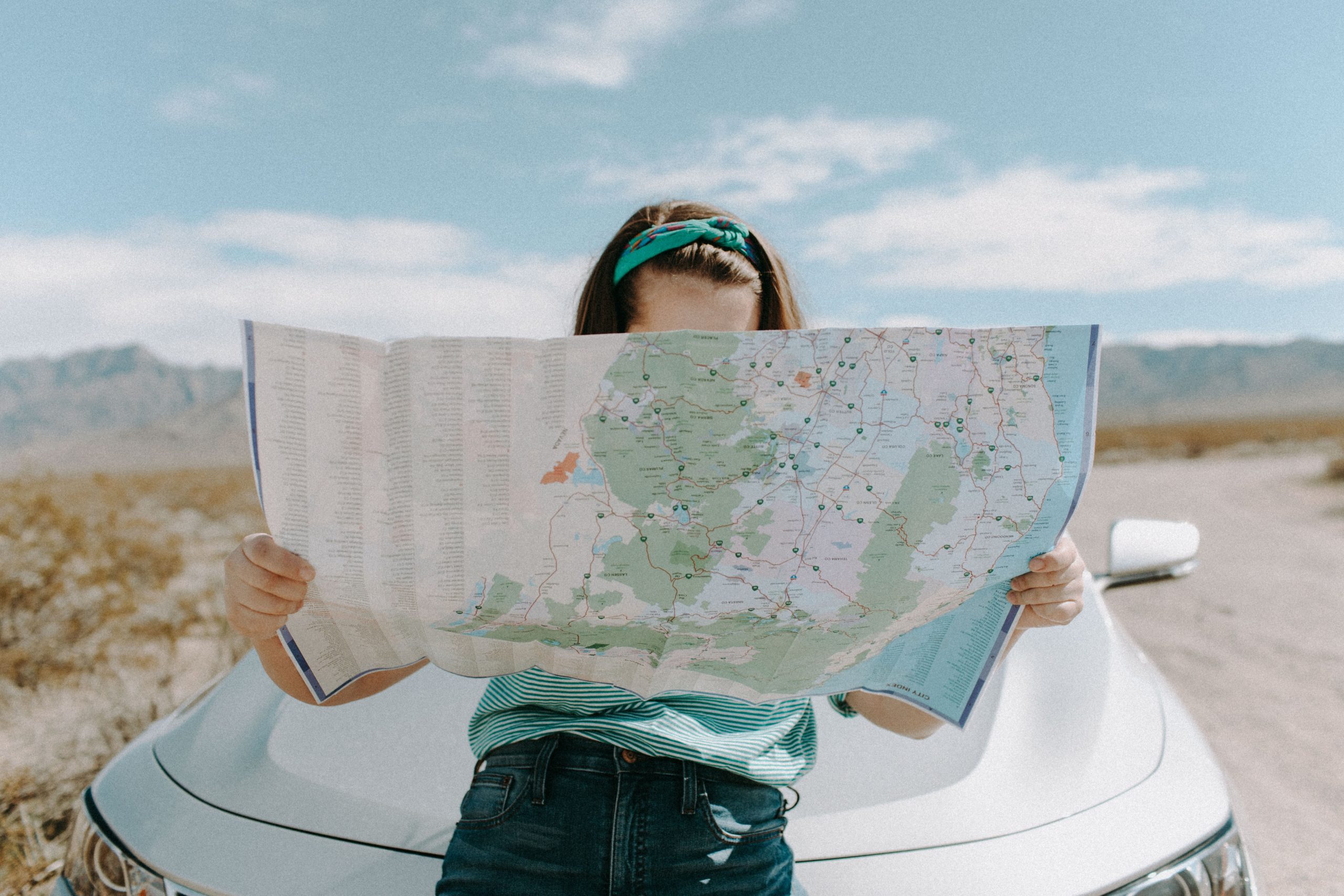 Full image of A woman reading a map. Photo by Leah Kelly.