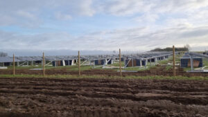 Solar panels under construction in a field