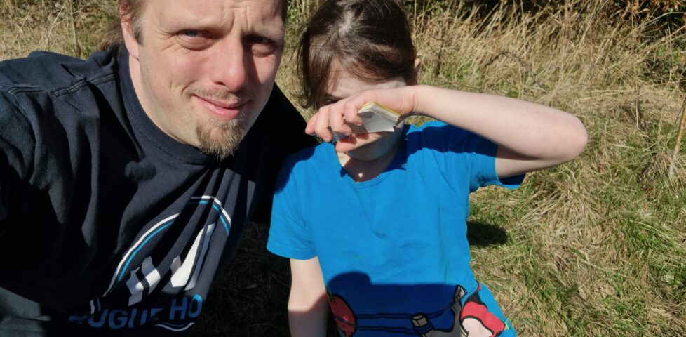 Dan and Annabel with a geocache.