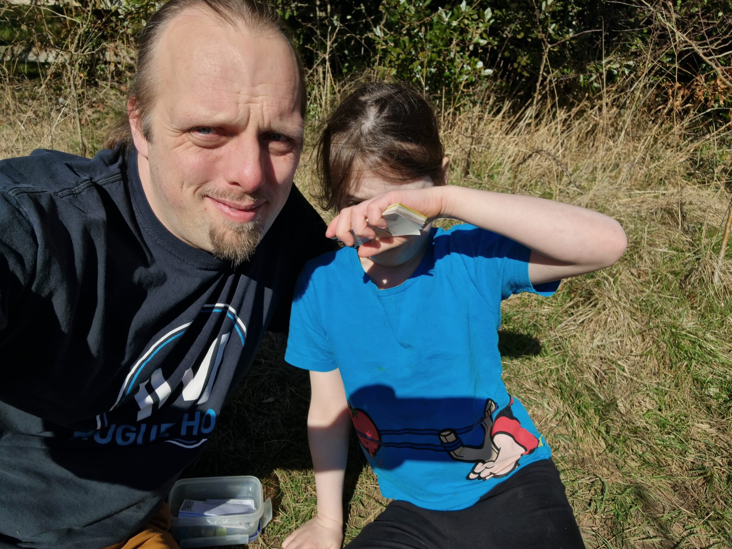 Full image of Dan and Annabel with a geocache.