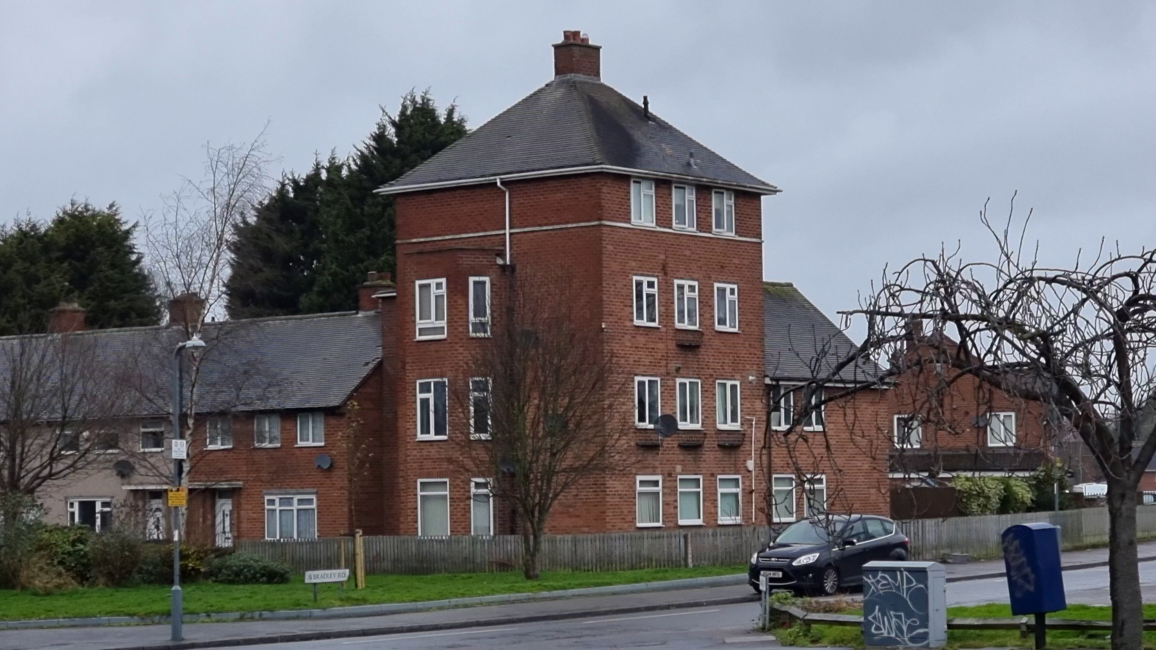 Full image of "House-shaped" four-storey block of flats