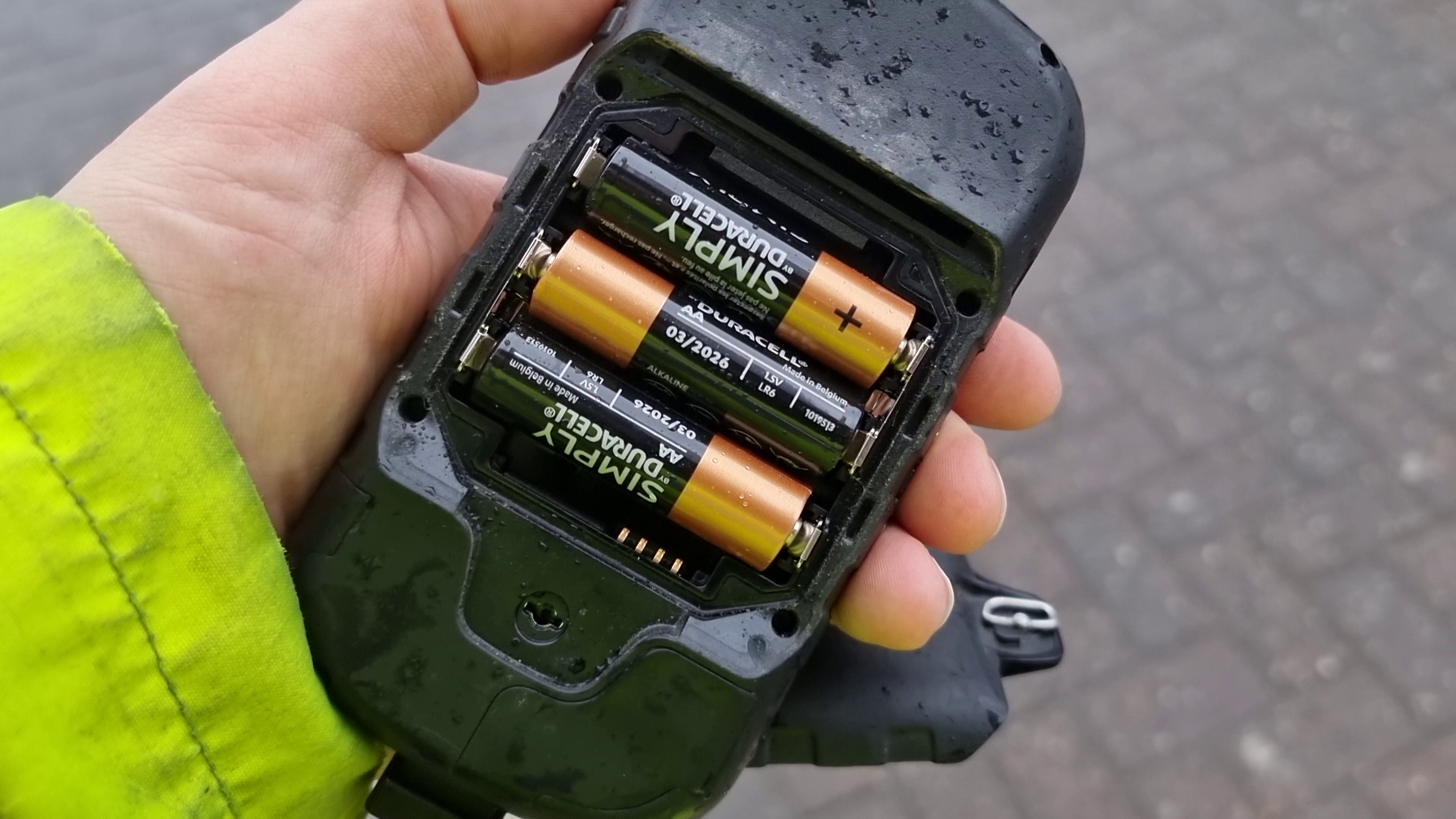 Full image of Open GPS receiver with three AA batteries inserted
