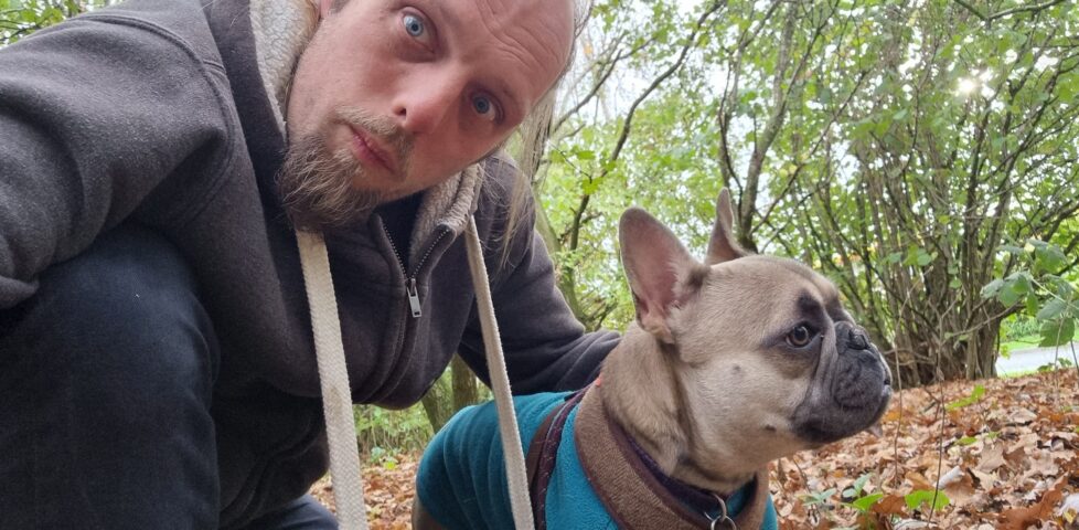 Dan and Demmy in a lightly-wooded area.