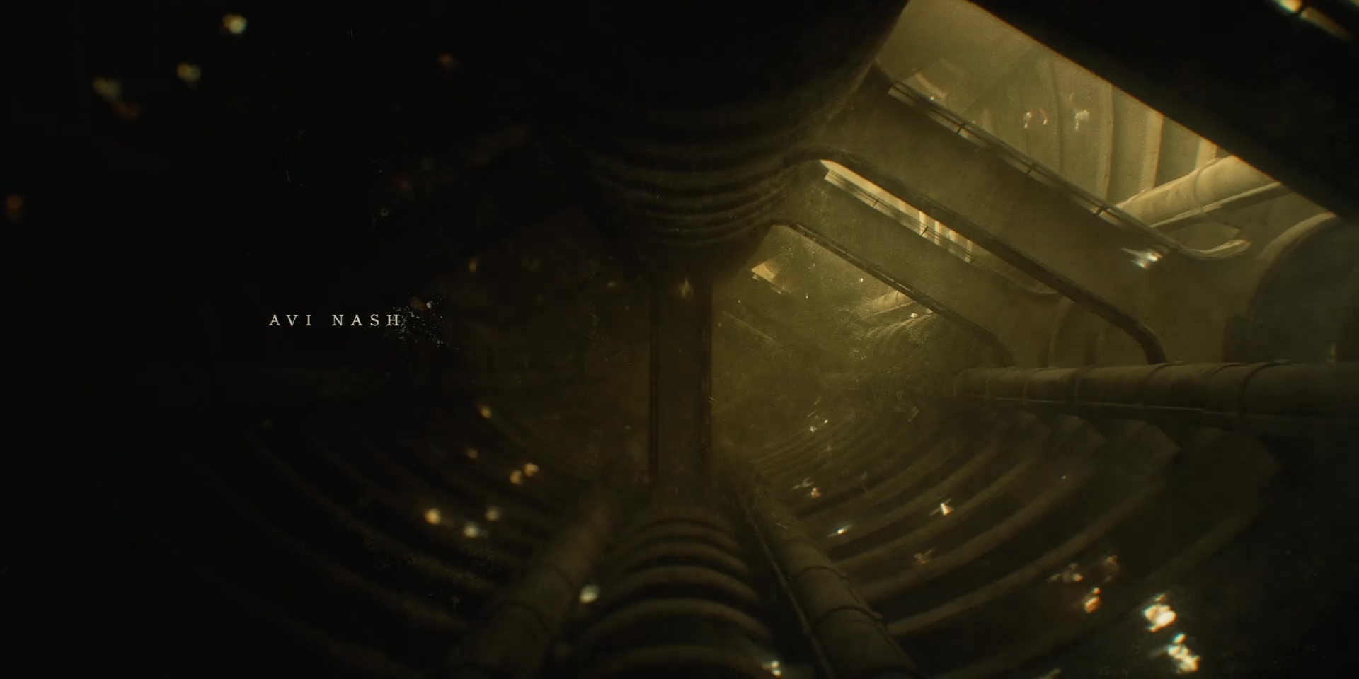 Full image of Sepia view "down" into a deep silo, with landings and skywalks visible.