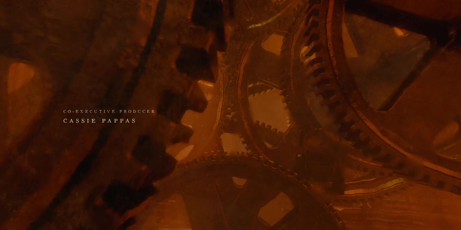 Full image of Many cogs whirl in a firey light.