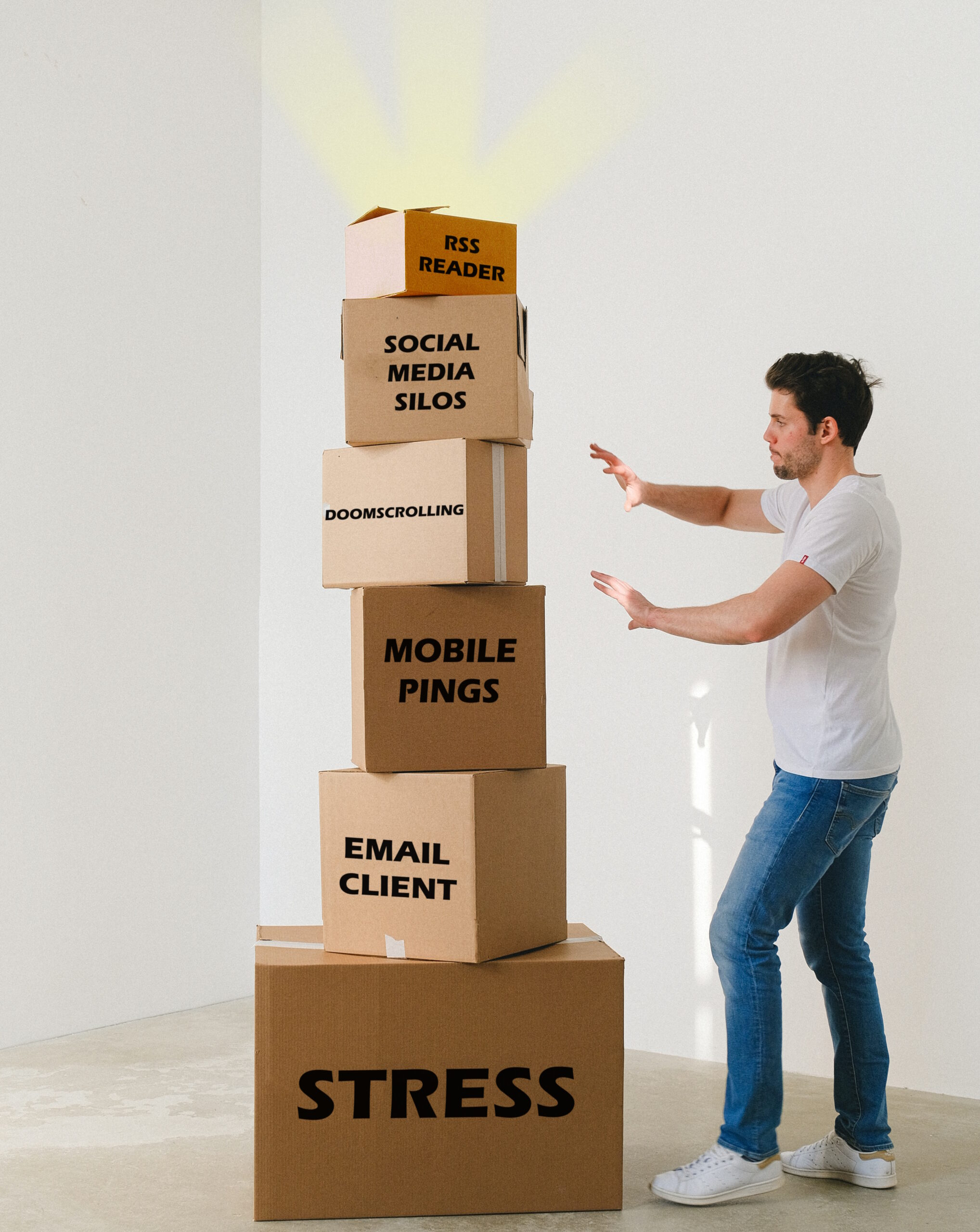 Full image of A white man with dark hair, wearing jeans and a t-shirt, moves to push over a stack of carboard boxes, each smaller than the one beneath it. From bottom to top, the boxes are labelled: stress, email client, mobile pings, doomscrolling, social media silos... and the very top, very smallest box, which glows with sunbeams emitted from it, reads "rss reader".