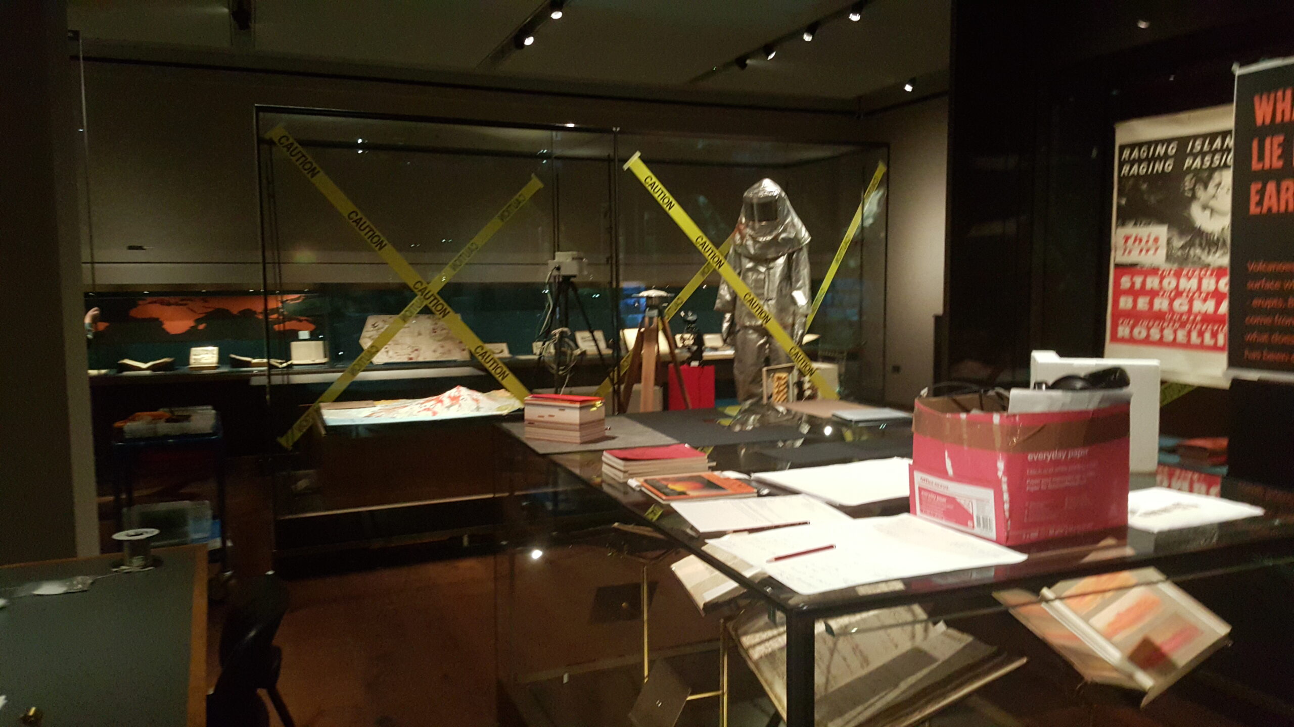 Full image of Under-construction exhibition including a highly-reflective suit worn by volcano field researchers.