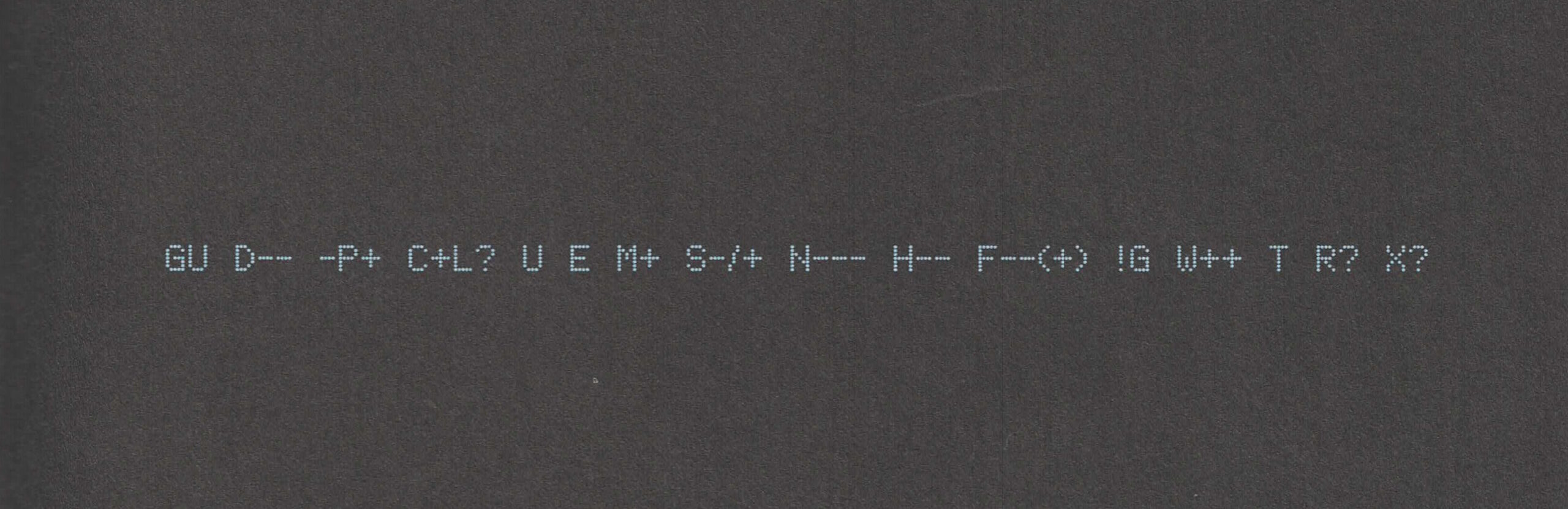 Full image of A "Geek Code Block", printed in a dot-matrix style font, light-blue on black, reads: GU D-- -P+ C+L? U E M+ S-/+ N--- H-- F--(+) !G W++ T R? X?