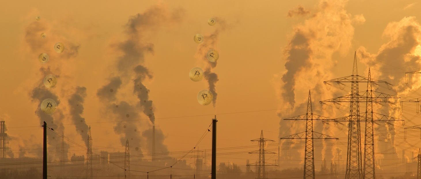 Full image of Industrial sprawl at sunset: countless tall chimneys belch smoke alongside crisscrossing power lines. In the smoke, the outline of "physical" Bitcoins can be seen.