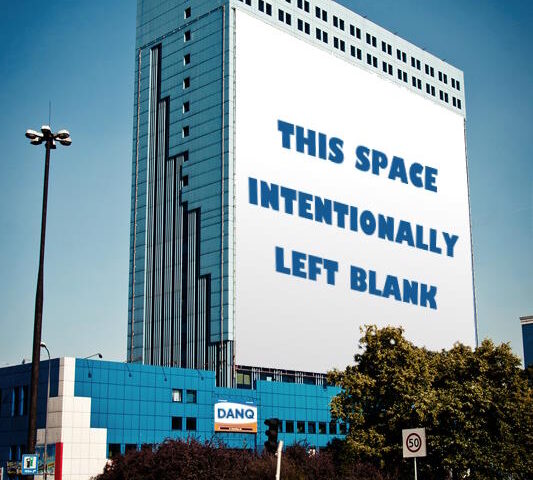 Building-sized billboard saying "THIS SPACE INTENTIONALLY LEFT BLANK".