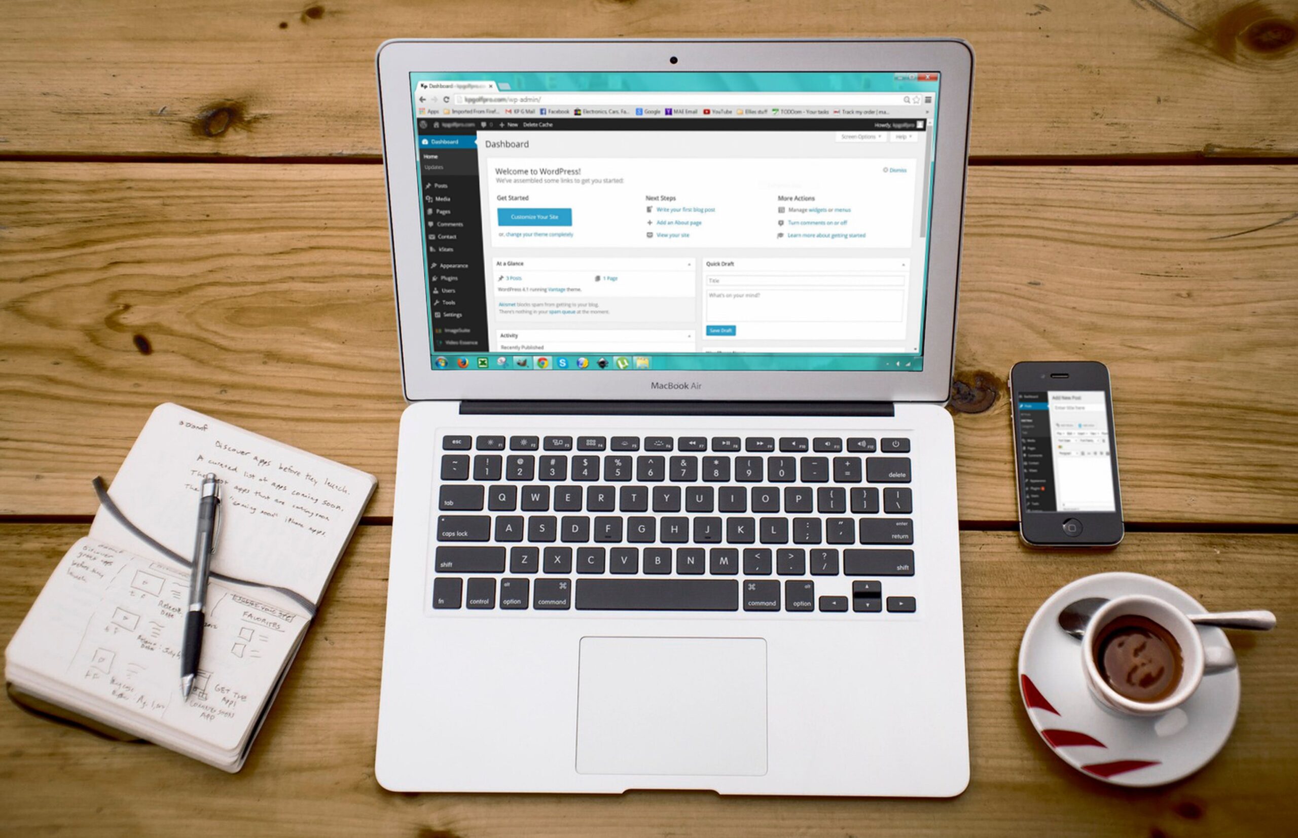 Full image of A laptop computer on a desk, showing a WordPress wp-admin page.