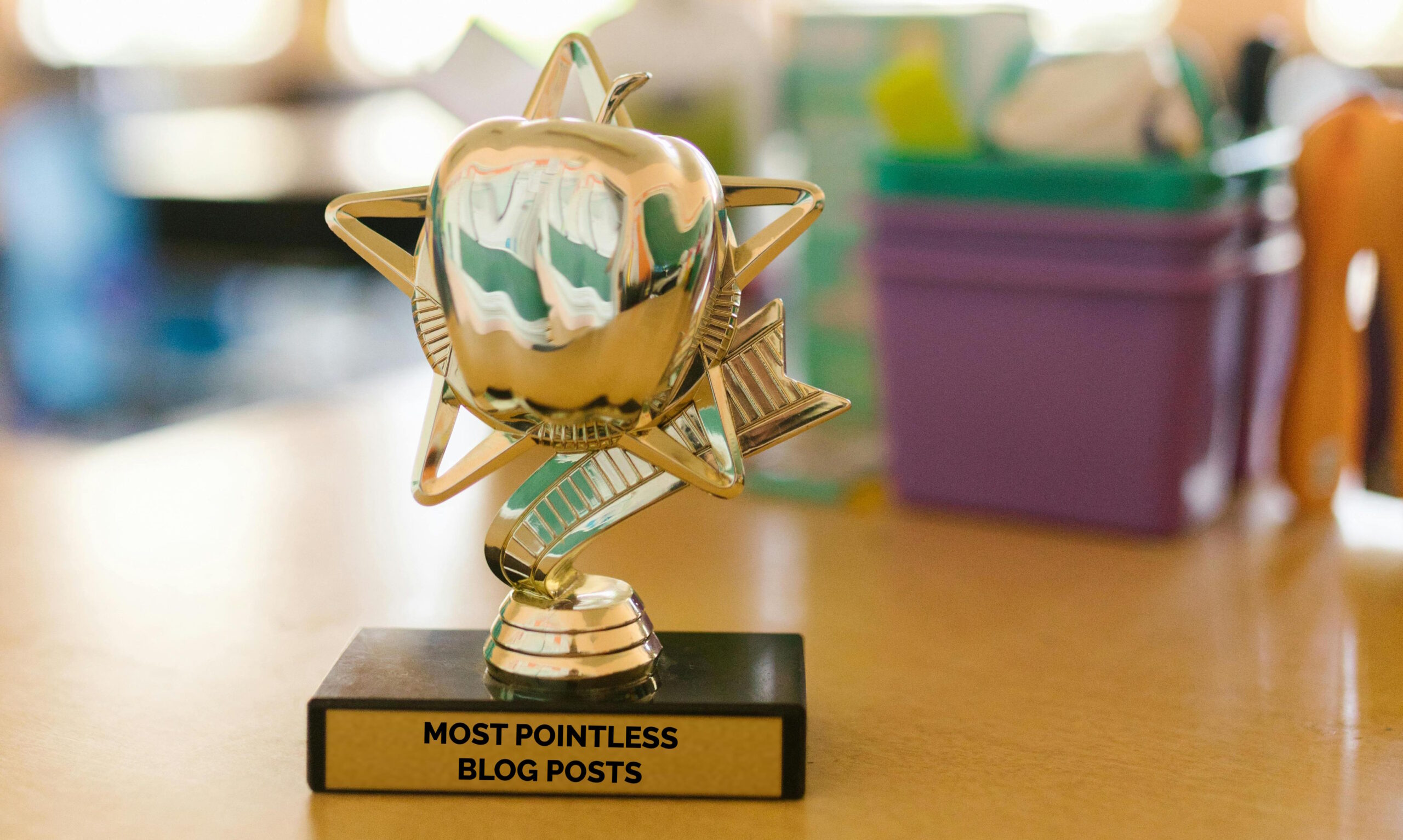 Full image of Trophy on a desk with the plaque "most pointless blog posts".