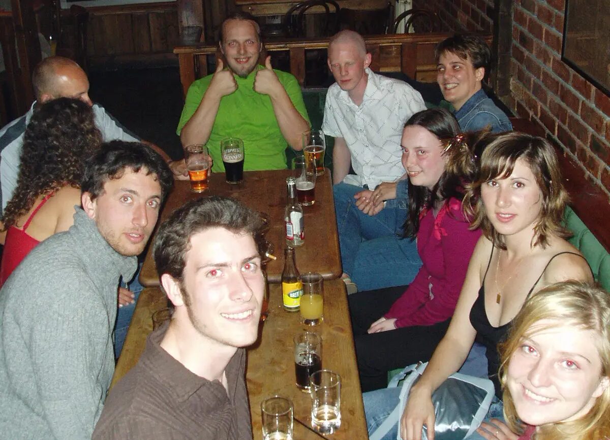 Full image of Dan with coworkers and friends drinking in a pub.