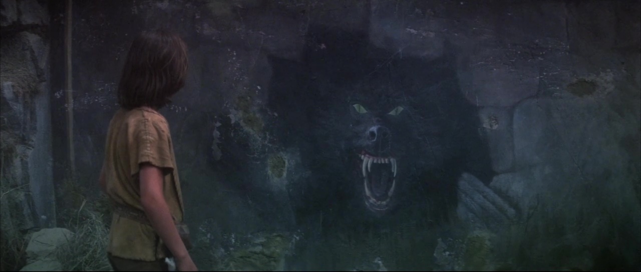 Full image of Frame from 1984's The NeverEnding Story, showing Atreyu seeing the prophetic painting that shows the beast he's about to meet.