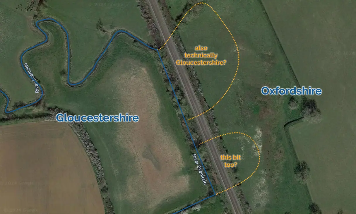 Full image of Map showing the border between Gloucestershire and Oxfordshire as defined by the original path of the River Evenlode near Kingham, but the Evenlode has been redirected as part of the construction of the railway, putting two small bits of Gloucestershire on the "wrong side" of the river.