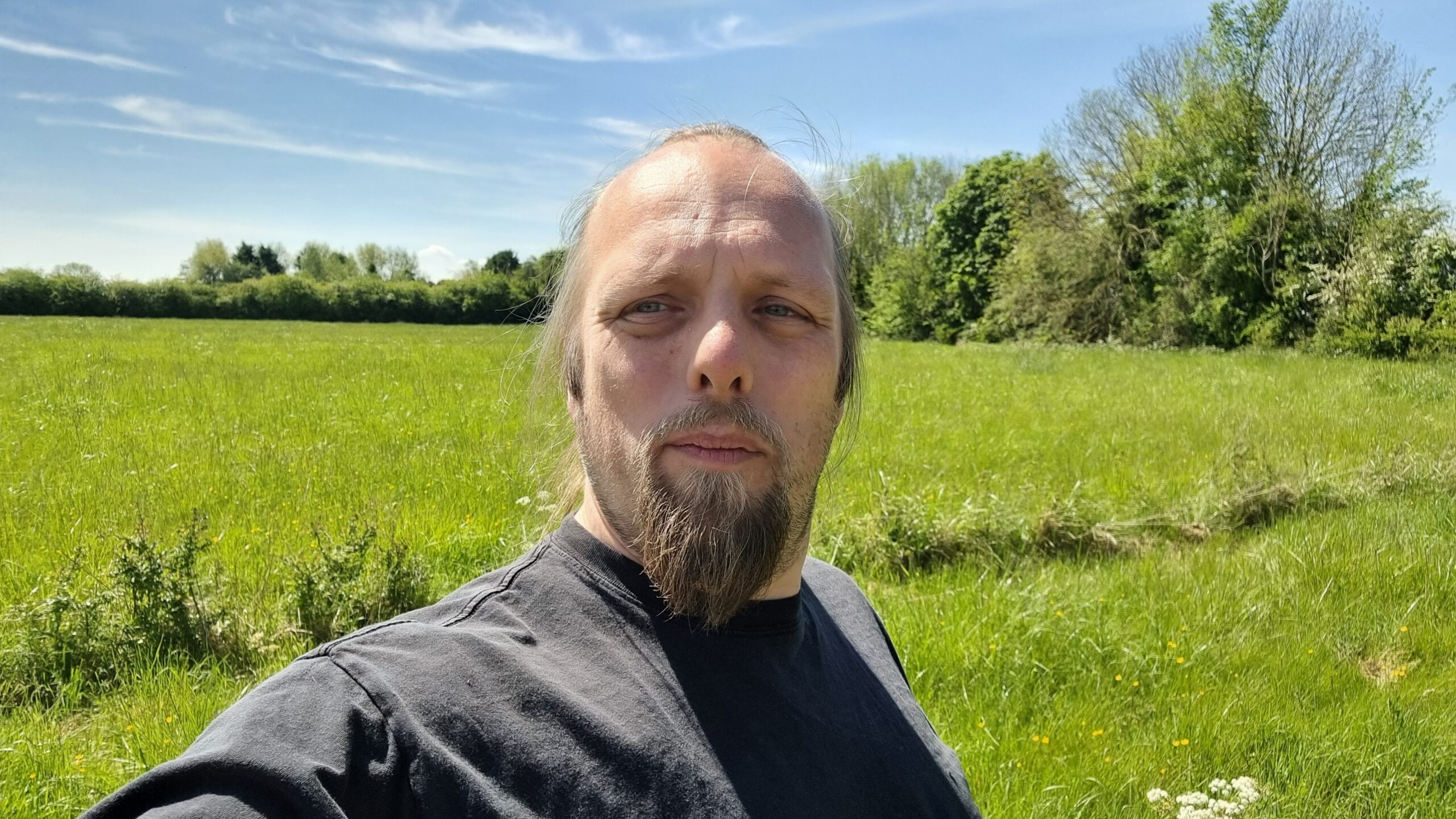 Full image of Dan in a meadow.