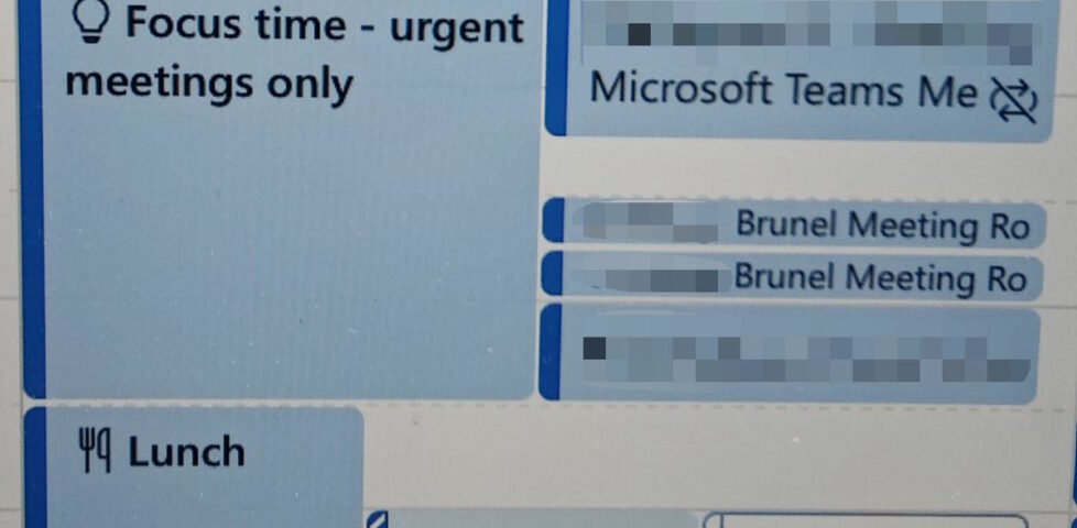 Digital calendar showing a 'focus time - urgent meetings only' block clashing with four other events.