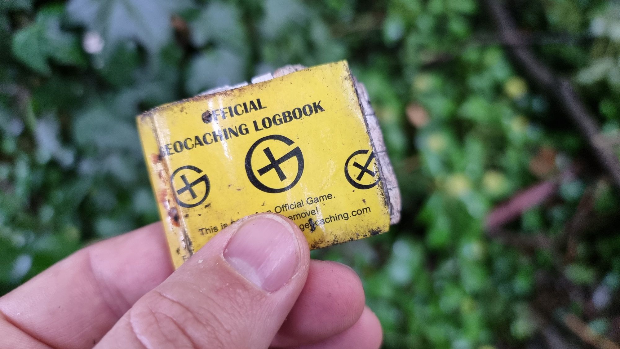 Full image of Damp geocaching log book,closed.