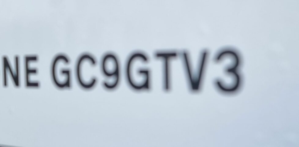 Part of a road sign, reading 'GC9GTV3'