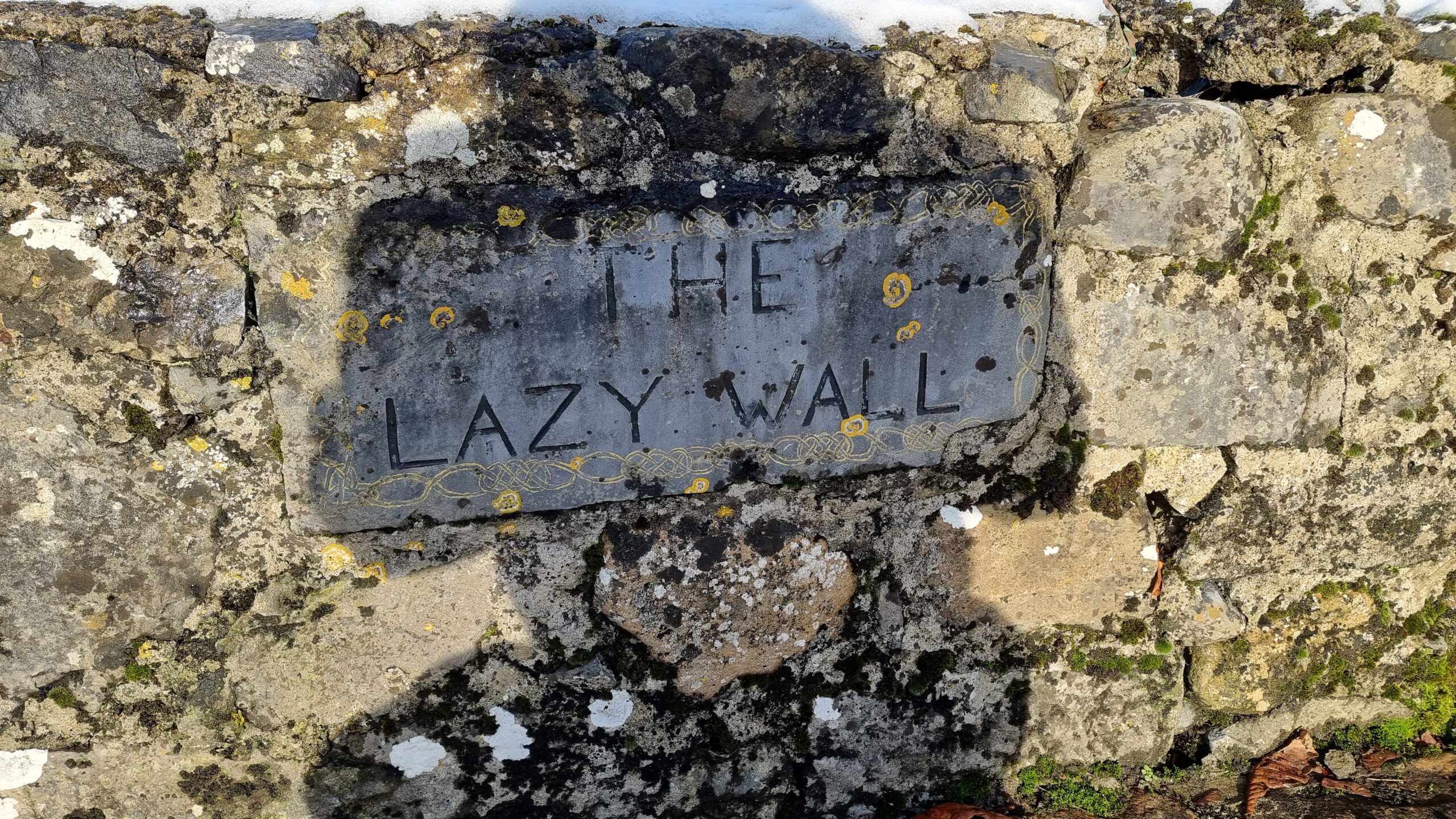 Full image of Sign saying The Lazy Wall.