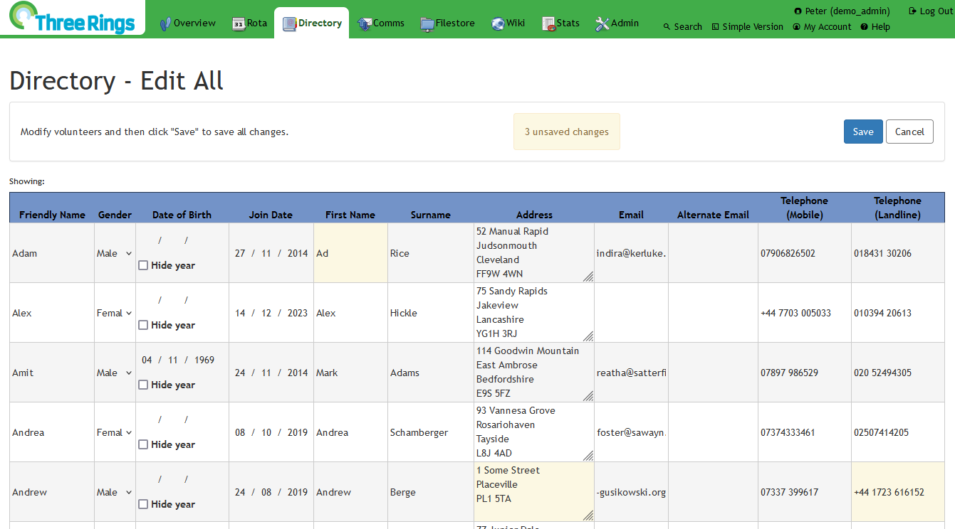 Full image of Screenshot showing a web page, 'Three Rings Directory - Edit All': a spreadsheet-like view of multiple volunteers, some of whom have had personal details like First Name, Address, or Telephone changed, resulting in these being highlighted and a prompt appearing to allow the changes to be saved/committed.