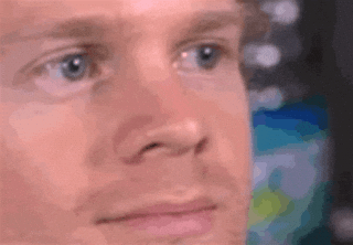 'Excuse me' GIF reaction. A white man blinks and looks surprised.
