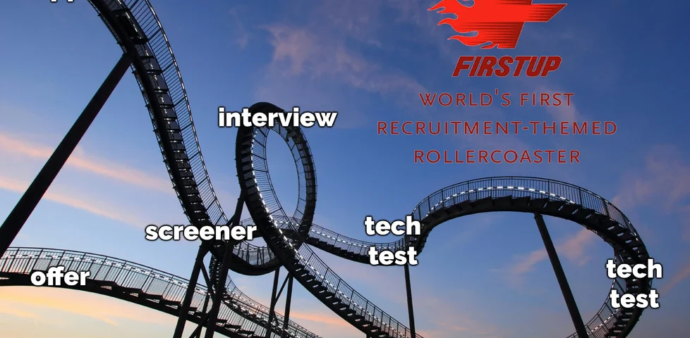 Photograph of a looping steel rollercoaster against a setting sun. A logo of a flaming 'F' in the corner declares it Firstup: World's First Recruitment-Themed Rollercoaster. The track is annotated with the steps of the process in order, from application to screener to interview and so on.