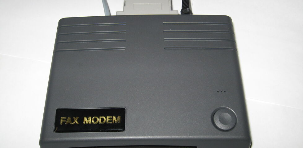 An xternal 33.6kbps serial port dial-up modem.