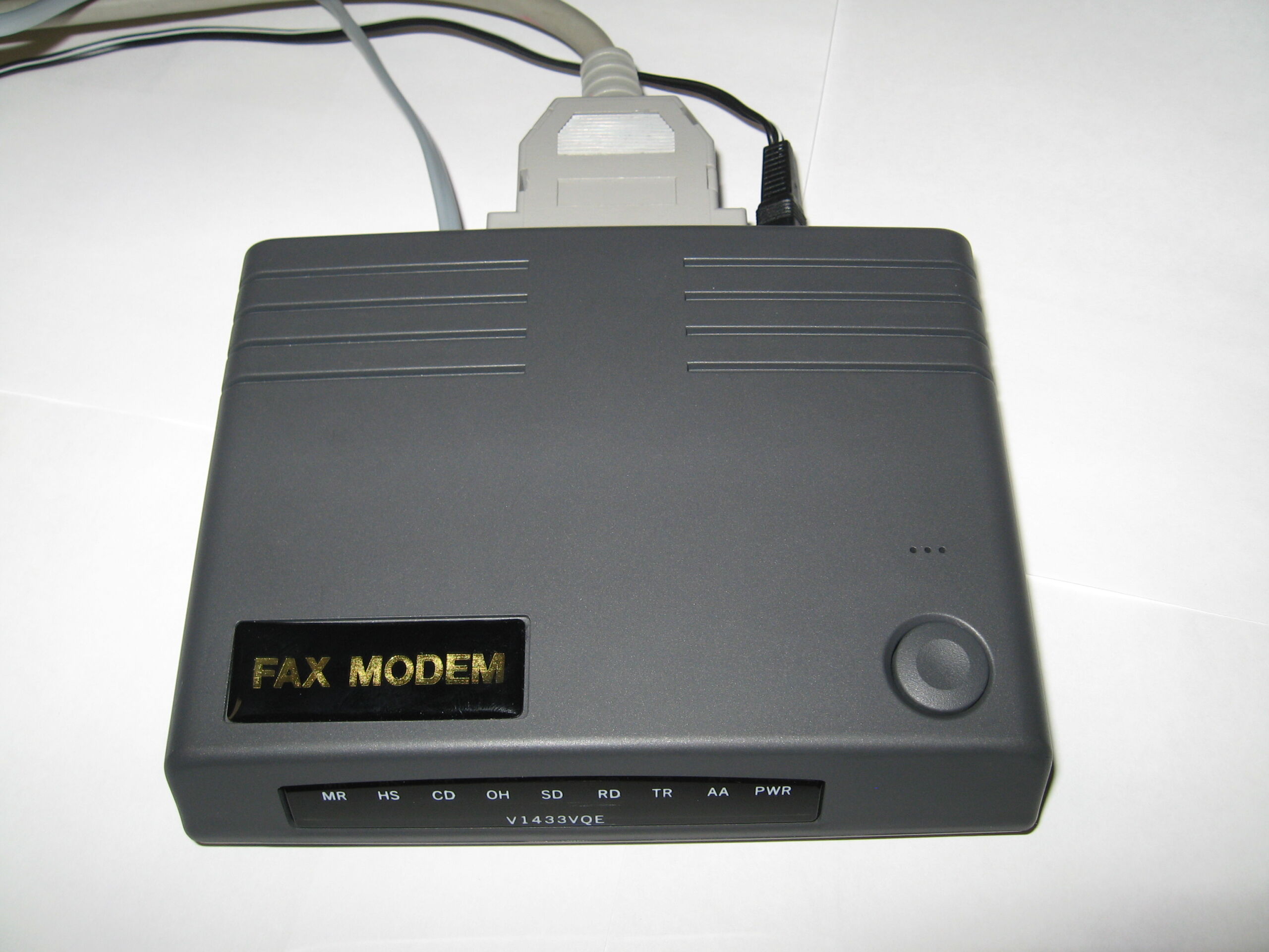 Full image of An xternal 33.6kbps serial port dial-up modem.